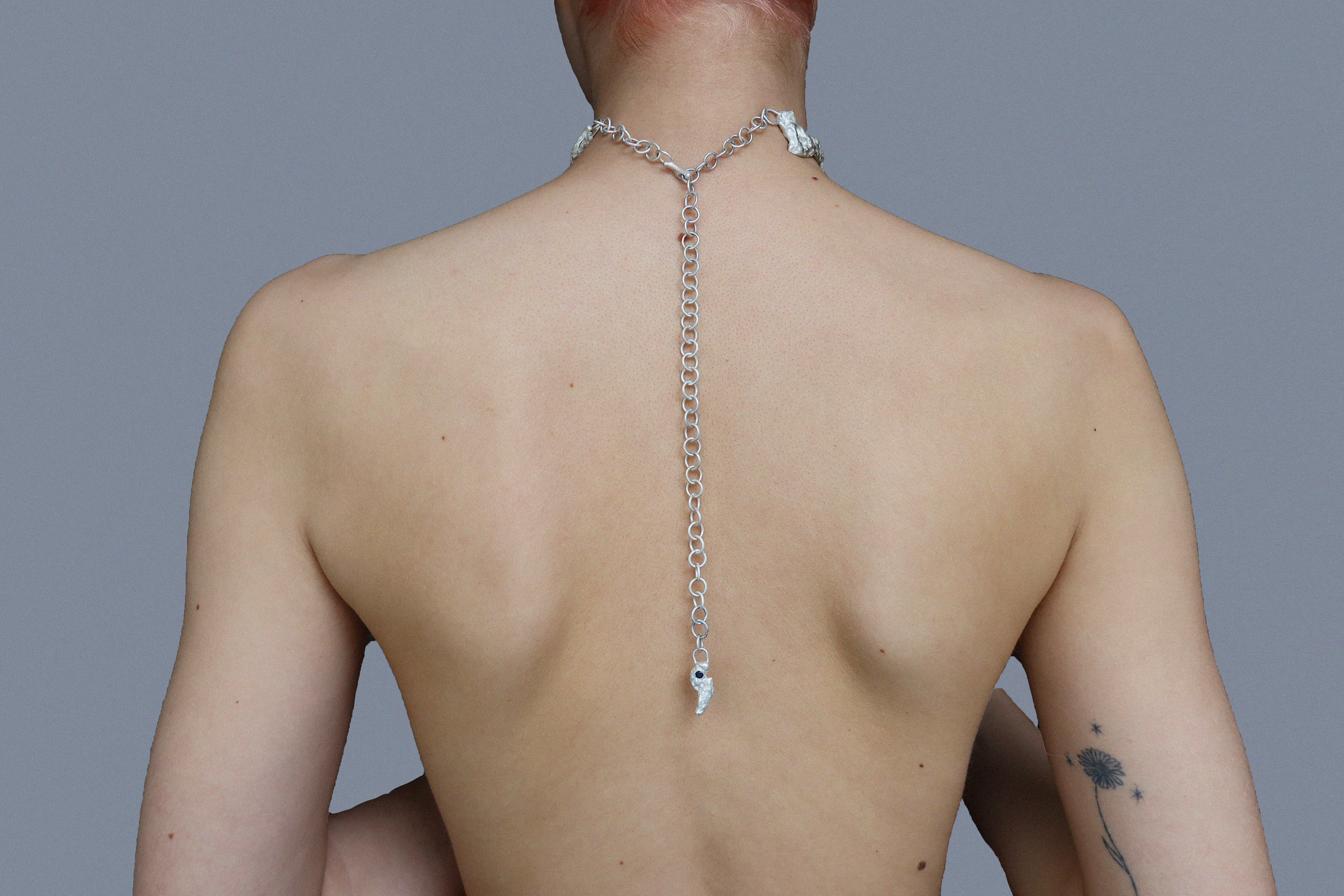 Earth cast silver choker with Sapphire. Back view