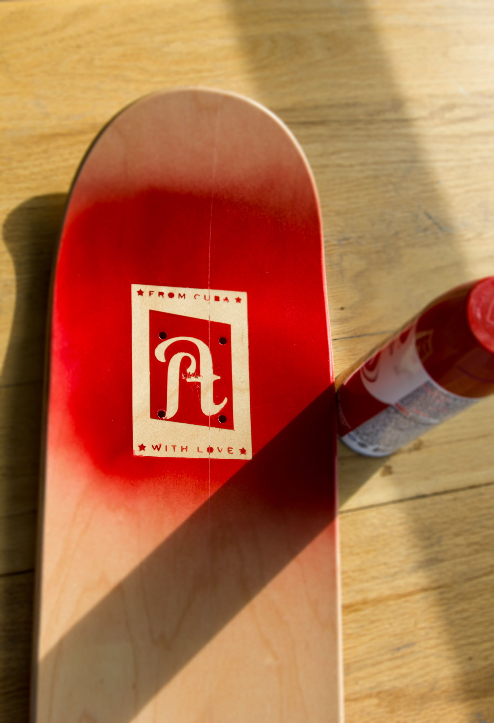Testing spray paint and vinyl sticker application on the skateboards