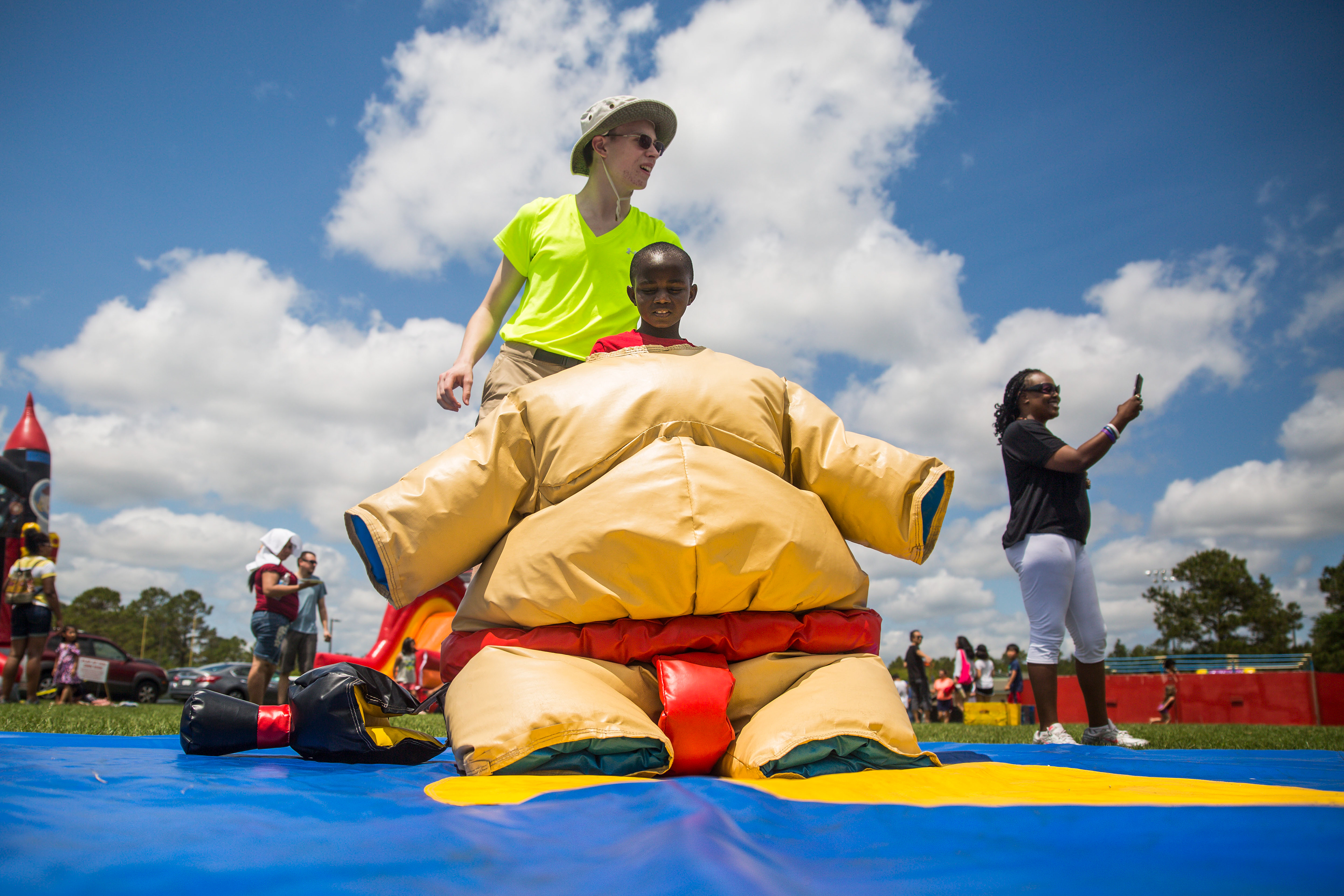 Daquan McCain, 8, tries on a sumo wresting suit during the 20th Annual Festival Latino at Ogden Park in Wilmington, NC on Saturday May 4, 2019.