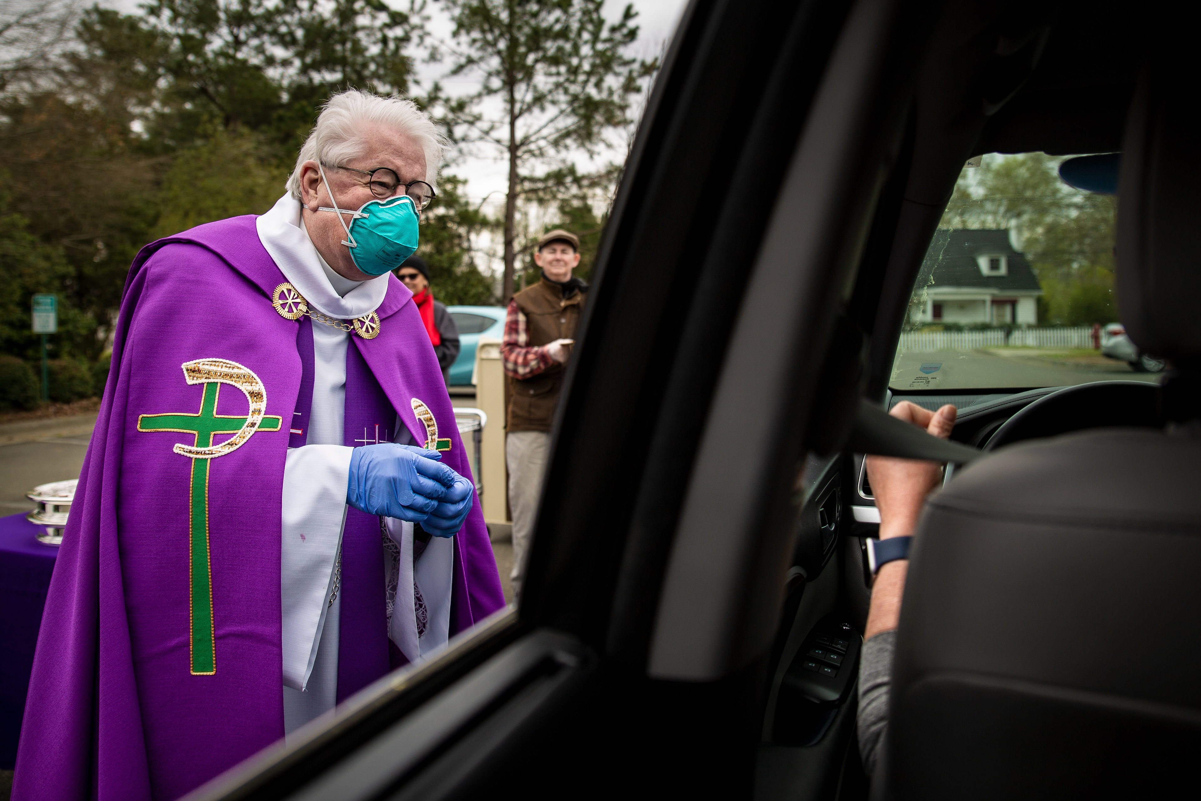 A pastor delivers drive-thru communion during the Covid-19 pandemic in Durham, NC on Sunday, March 22, 2020.