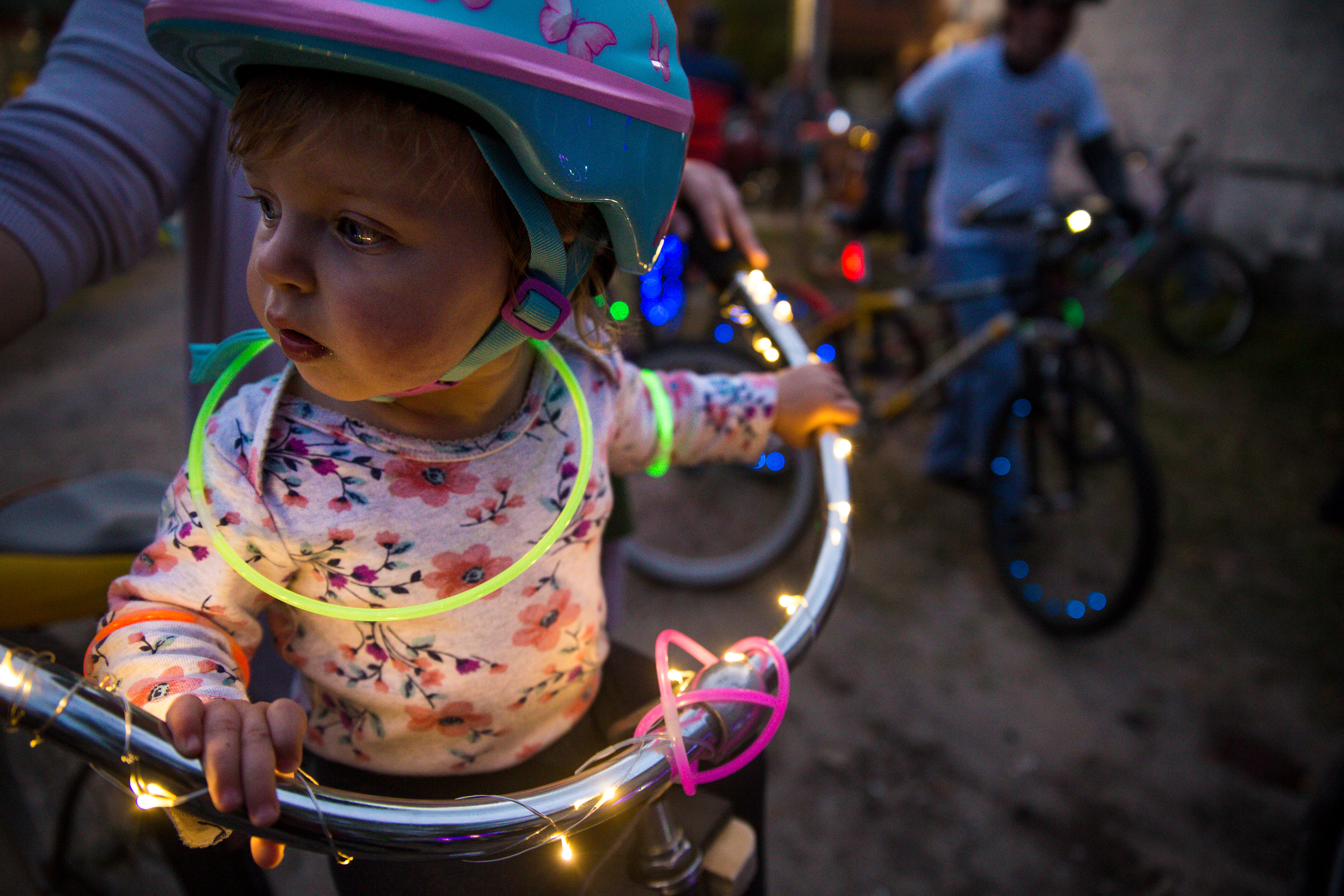 Anna Garmin, 15 months, attends the lighted bike parade with her mother, Olivia, during the 4th annual Alt-Zalea Music Festival on Saturday April 6, 2019 in Wilmington, N.C. Alt-Zalea Fest is a free, volunteer music festival that highlights local musicians.