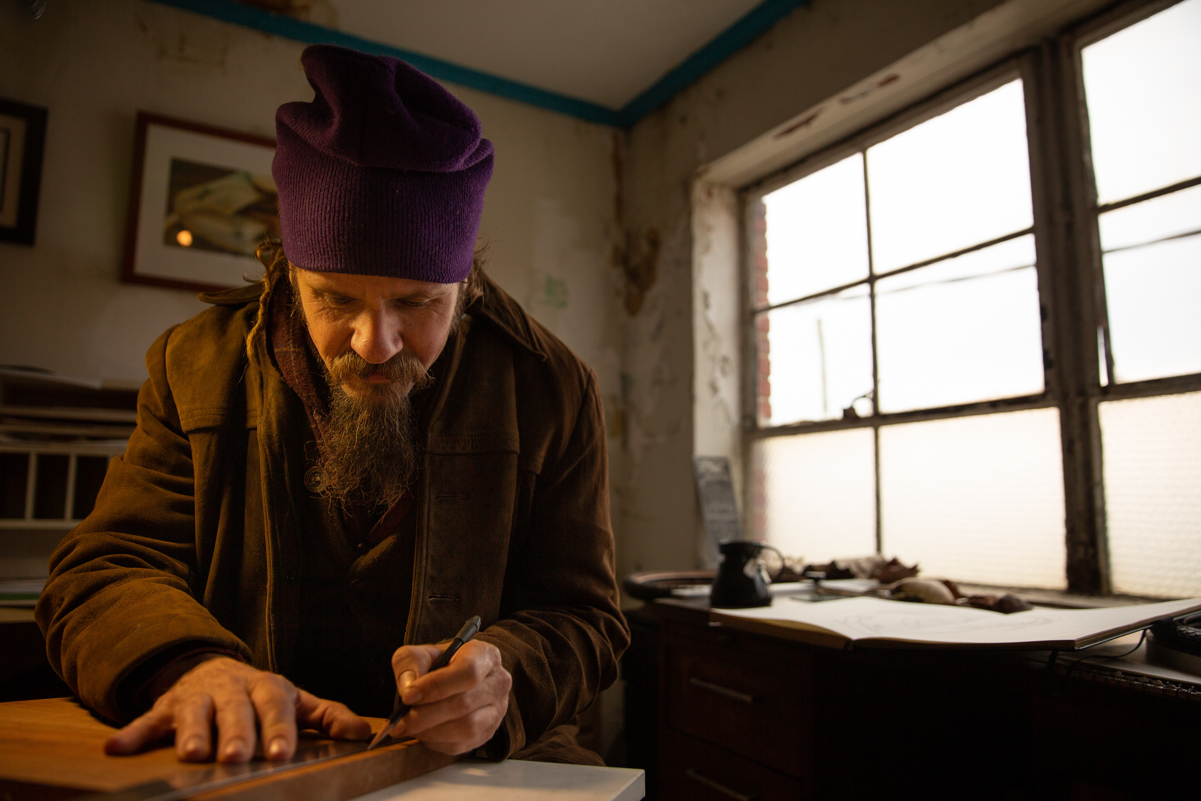 Travis Cohn, sculptor, graphic designer, and founder of Reptire Designs, repurposes used rubber into a wide variety of artwork, accessories, and practical designs inside his studio in Siler City, N.C.