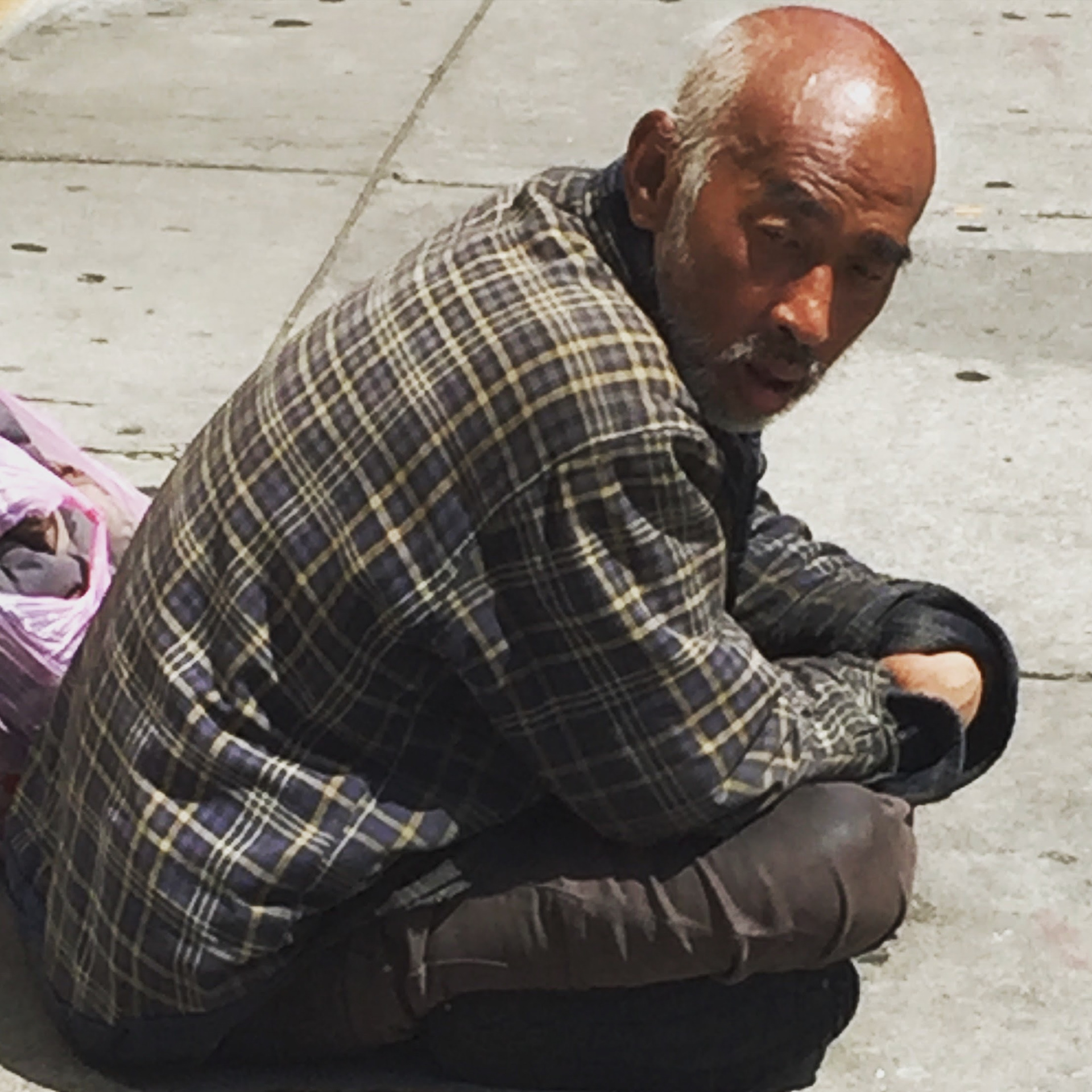 Squatting on the Sidewalk