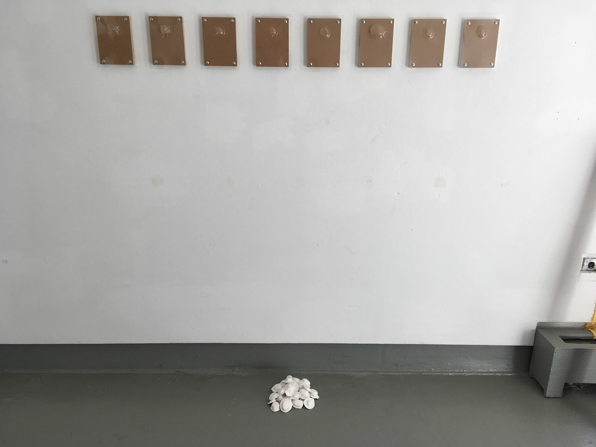Austin Abistado, Untitled, 2018. MDO, vacuum-formed plastic, plaster of Paris, sheet metal screws.