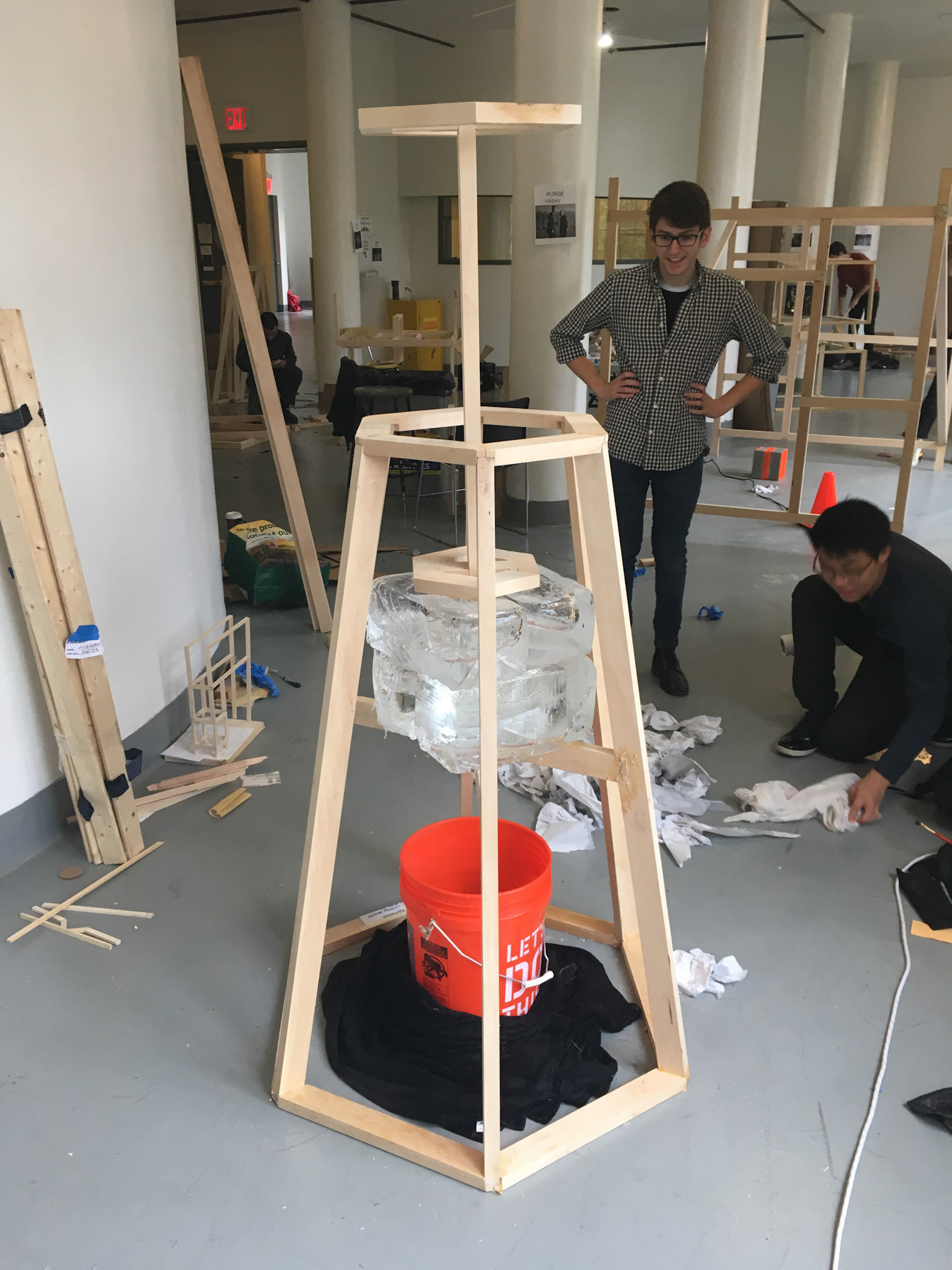 Austin Abistado, Untitled, 2017. Basswood, wood glue, ice, Home Depot bucket, cotton towel.