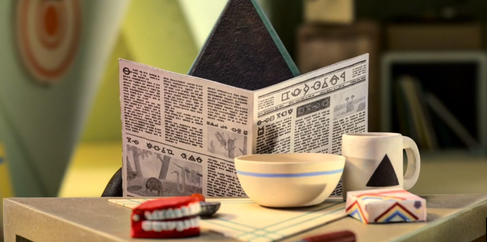 triangle with newspaper - movie still