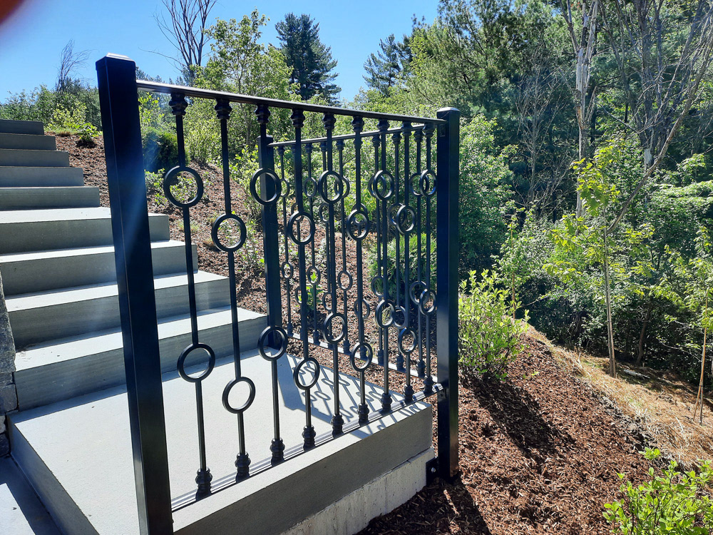 Stone steps lead to the back yard, which is one floor lower than the patio level.
