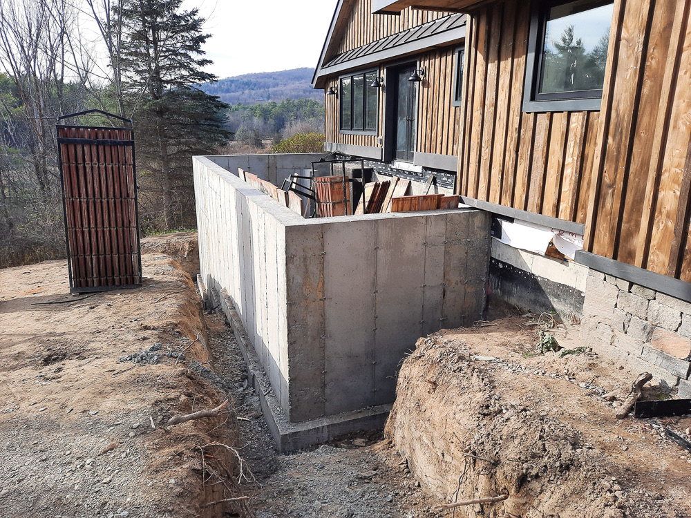 A poured-concrete foundation forms the base of the patio