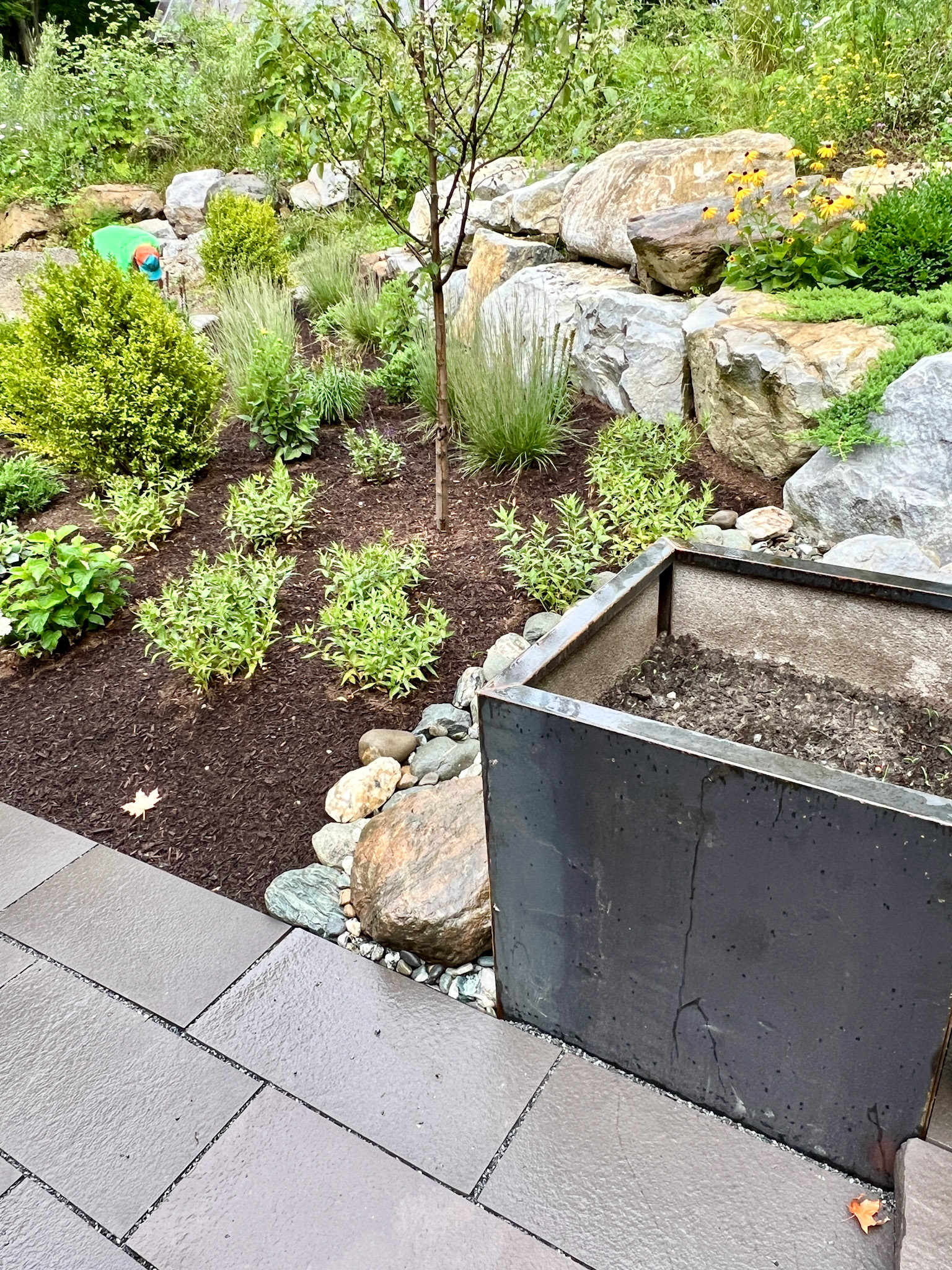 Steel planters are ready for potting soil and summer annuals.