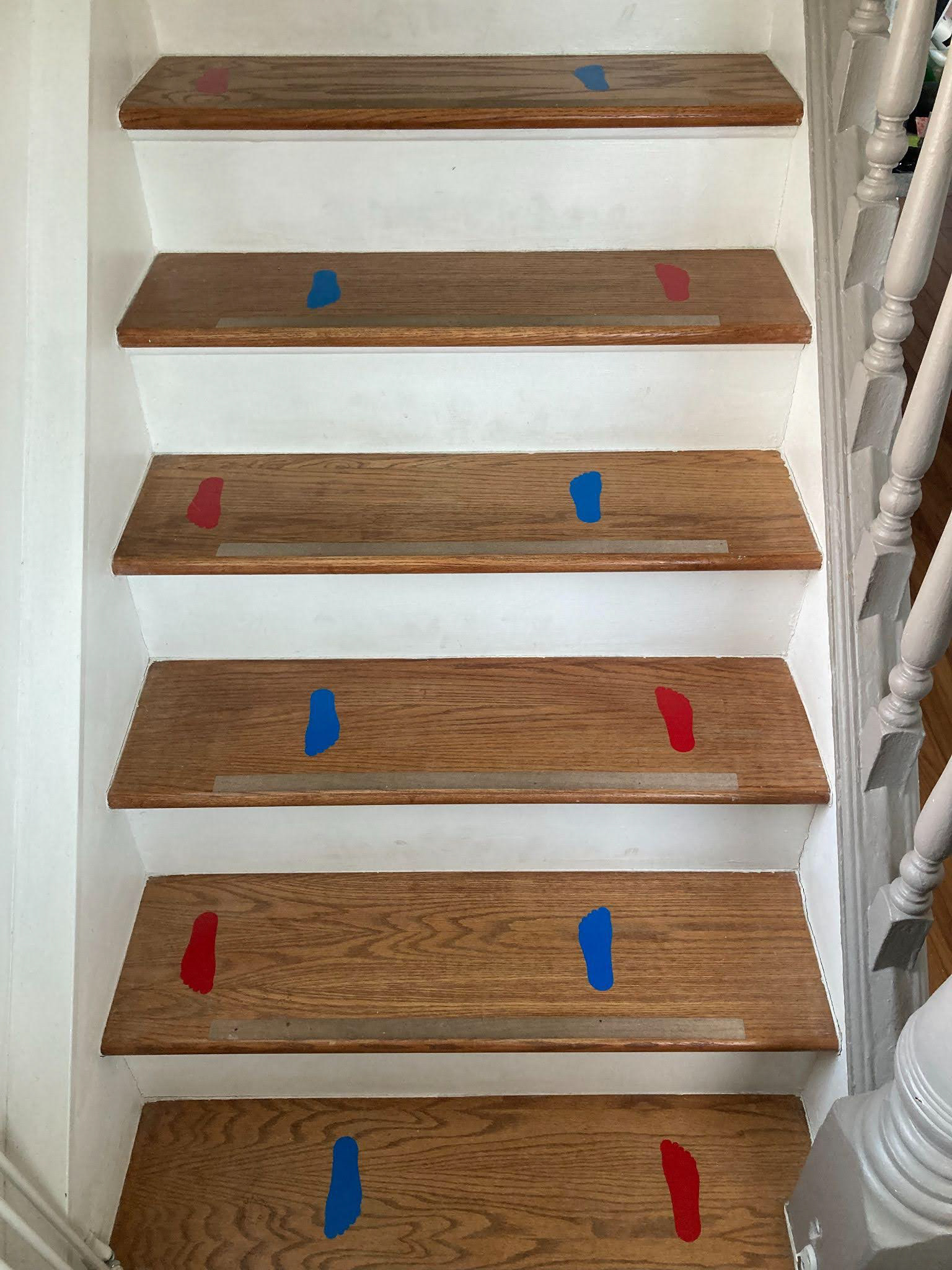 Stairs with wayfinding footprint-shaped vinyl.