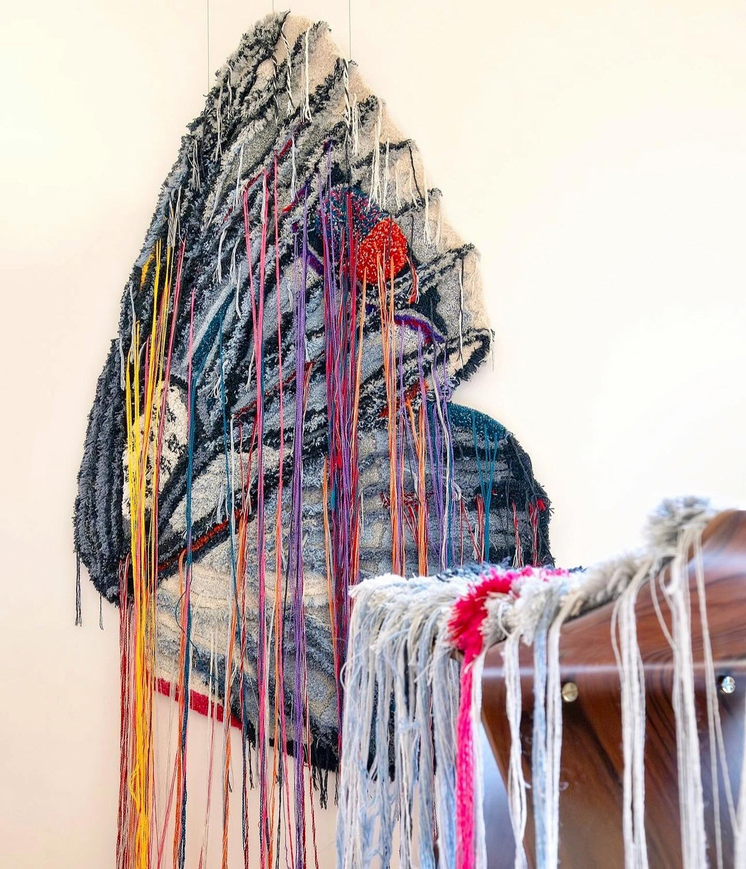 Wings of Change tapestry and Vitra stool cushion