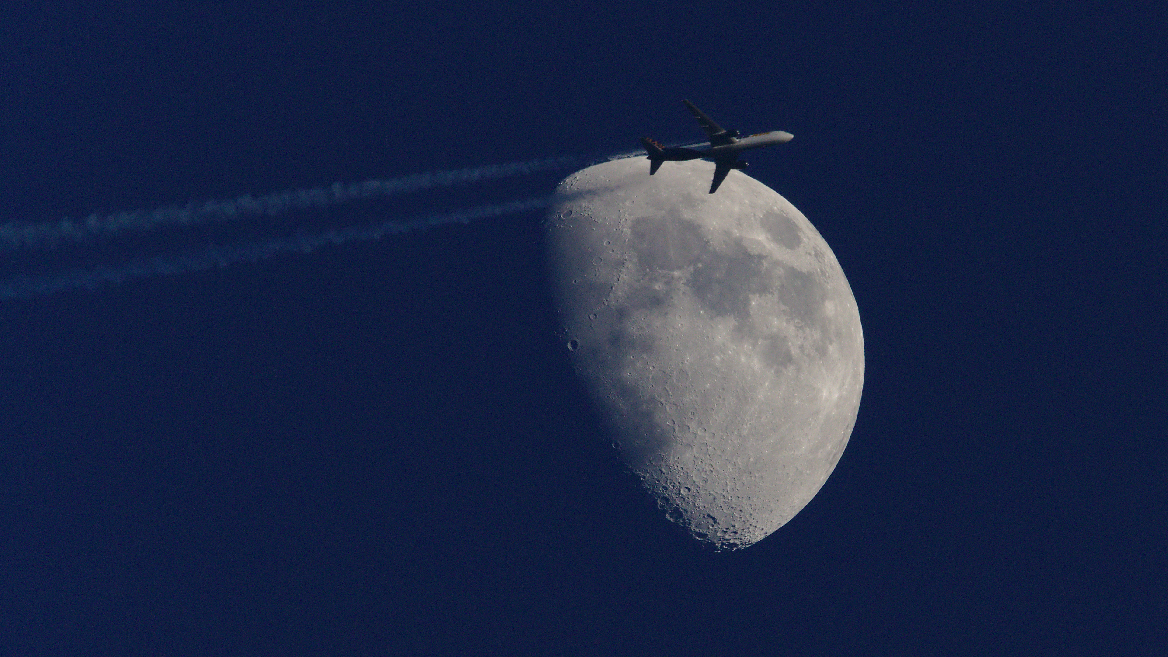 Moon and plane from Royd Moor Viewpoint