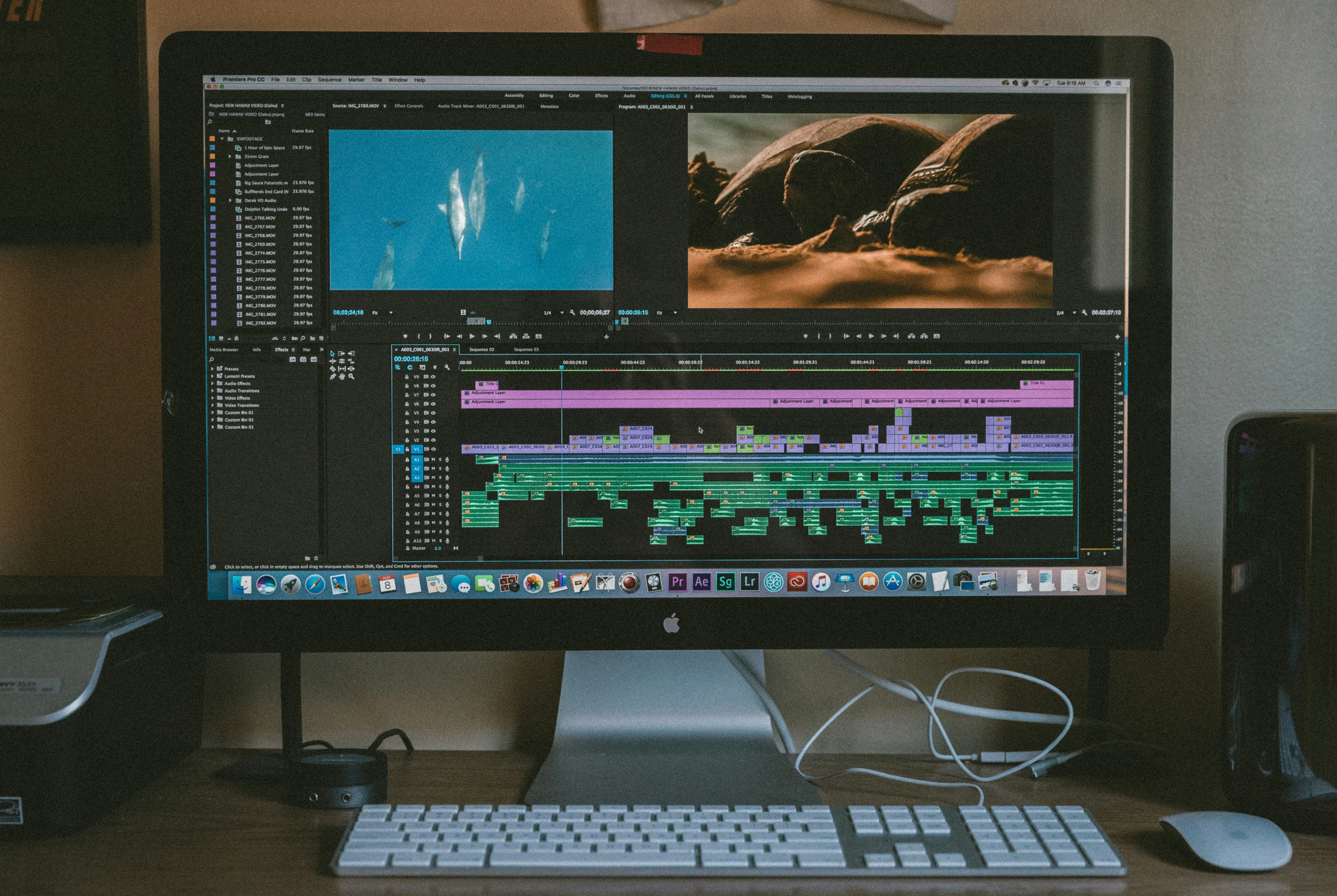 Photo of a desktop computer with editing software on the screen