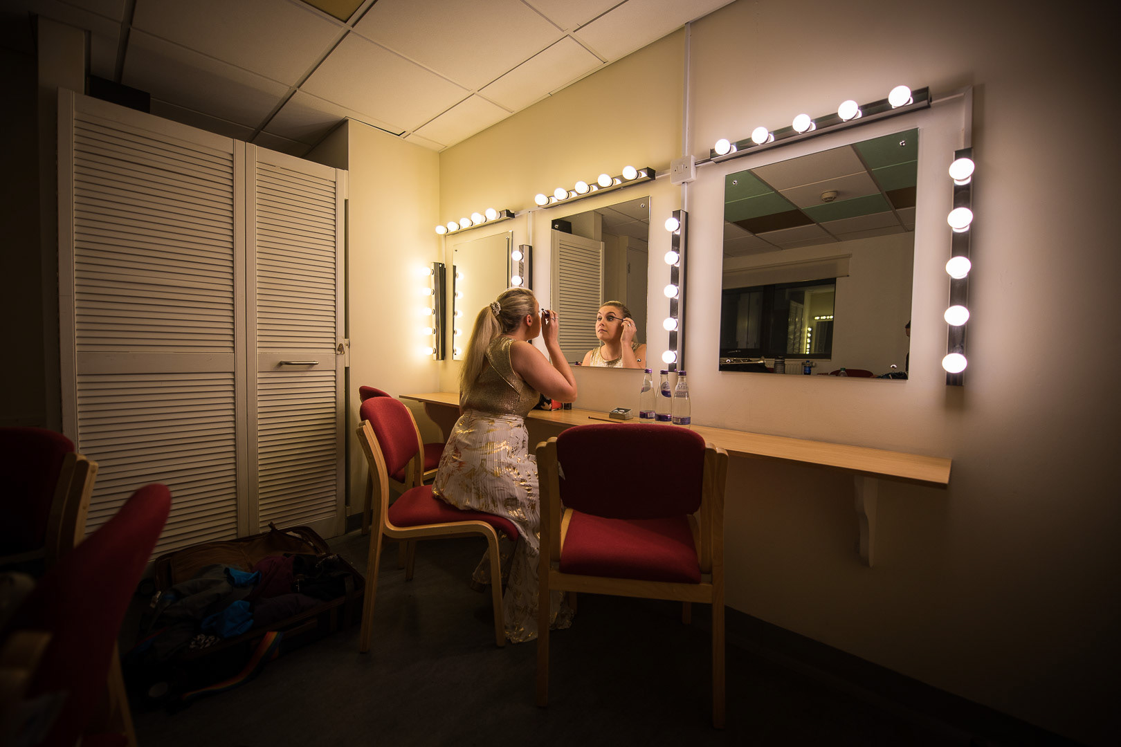 Matilda Lloyd (Saxophonist) prepares backstage.