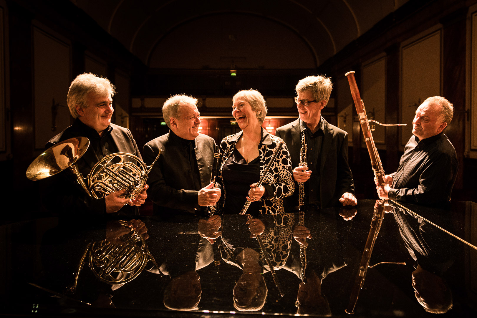 Michael Collins shares a laugh with his band before their concert.