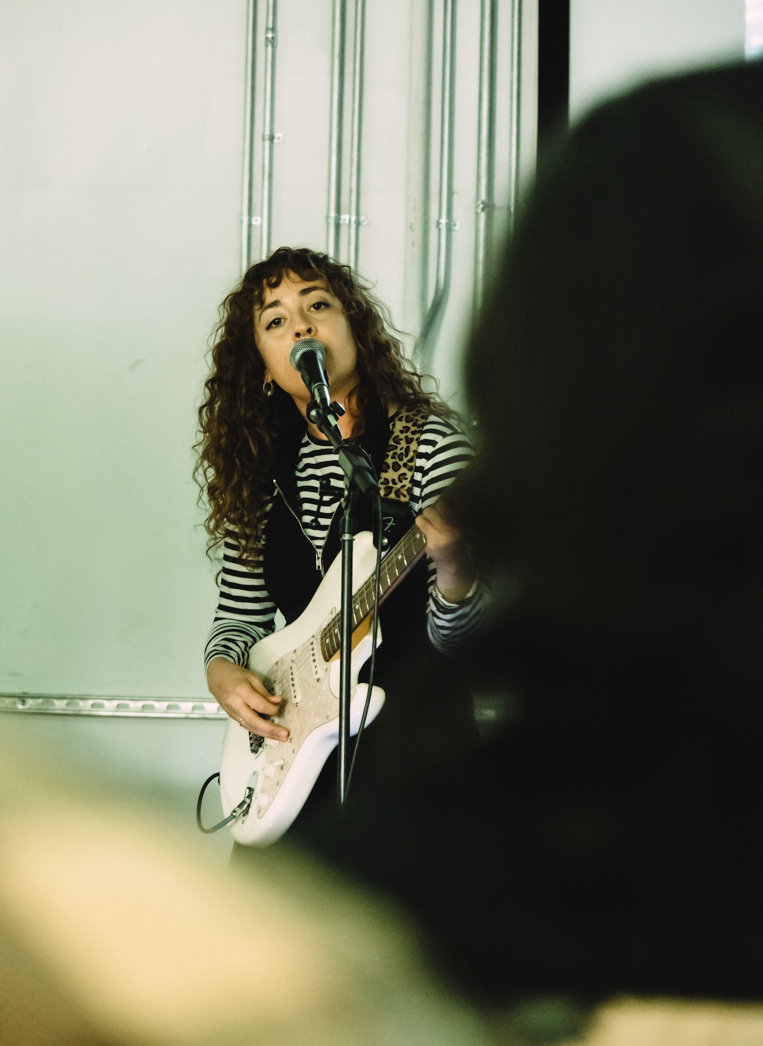 Pearl Earl lead singer Ariel sings softly to the gathered crowd at South By South West music festival in Austin, TX on Saturday March 17th, 2023.  Photo taken by Cassidy Henderson