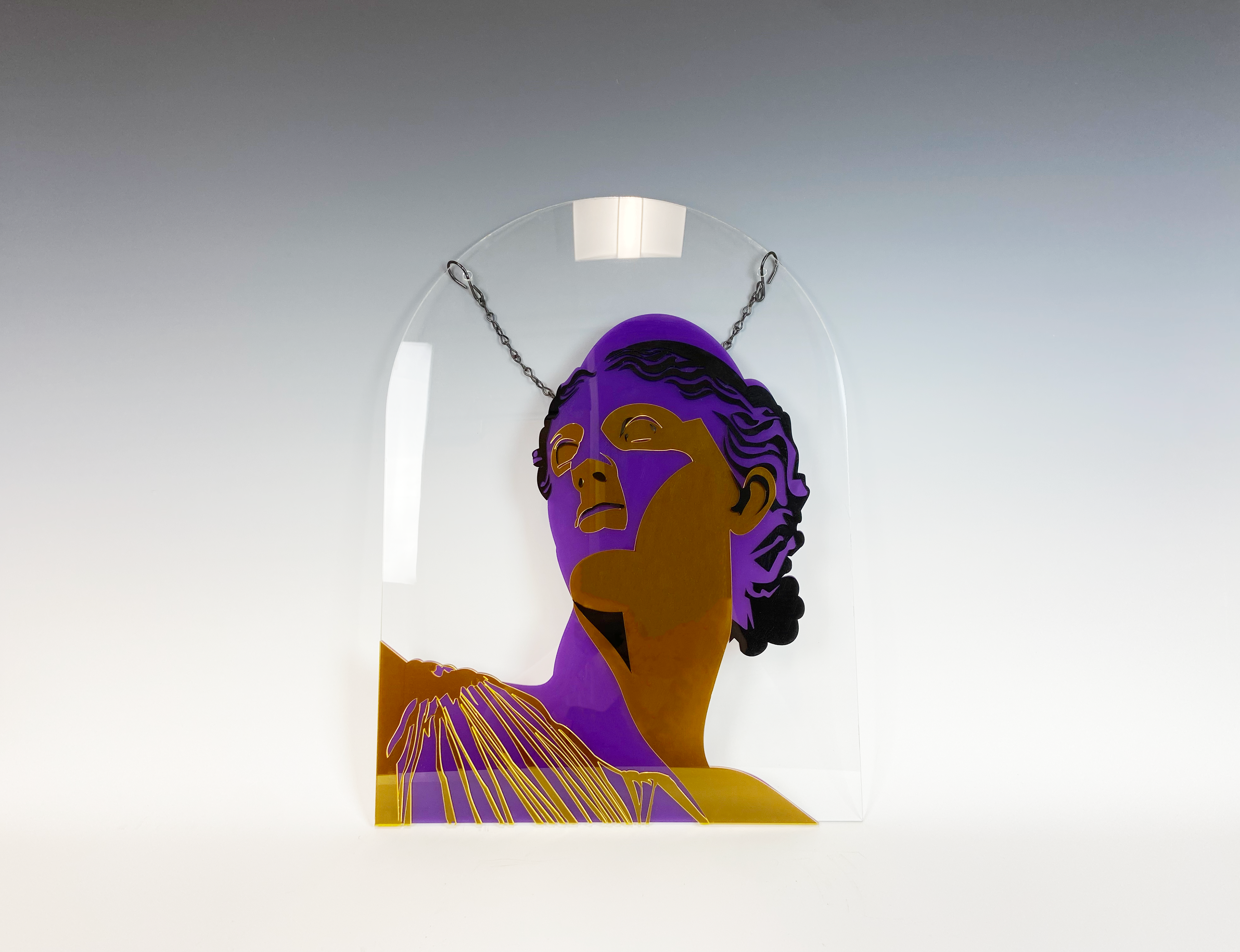 a wall hanging of greek goddess artemis made of translucent acrylic