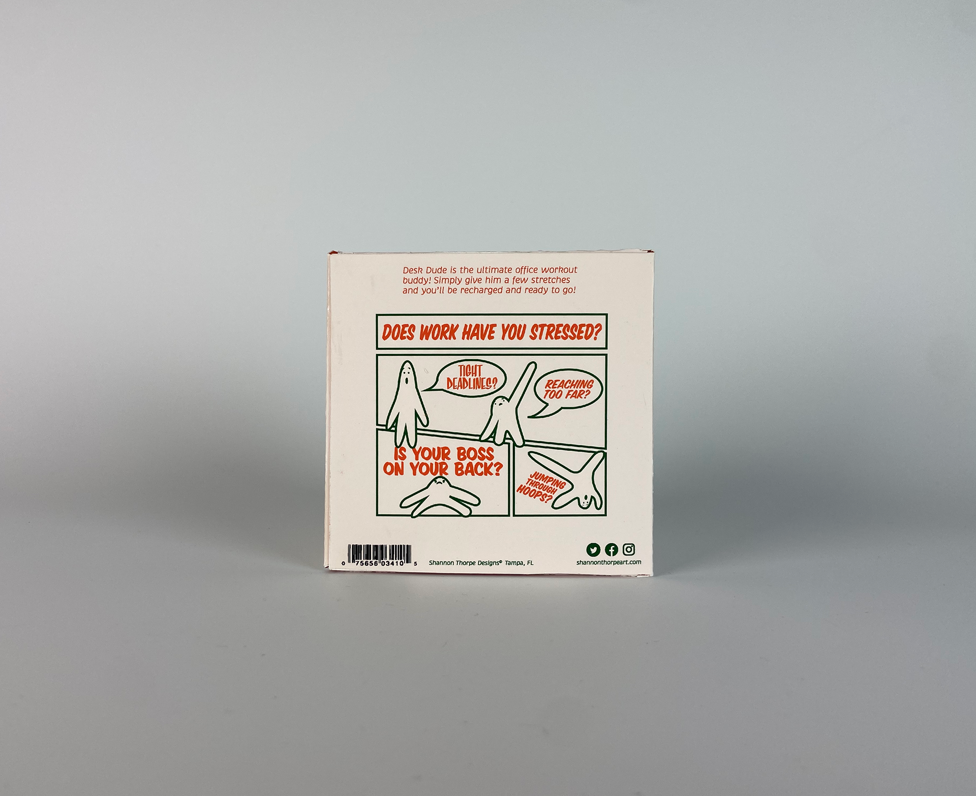 the back side of the packaging that features a comic, barcode, and social media icons