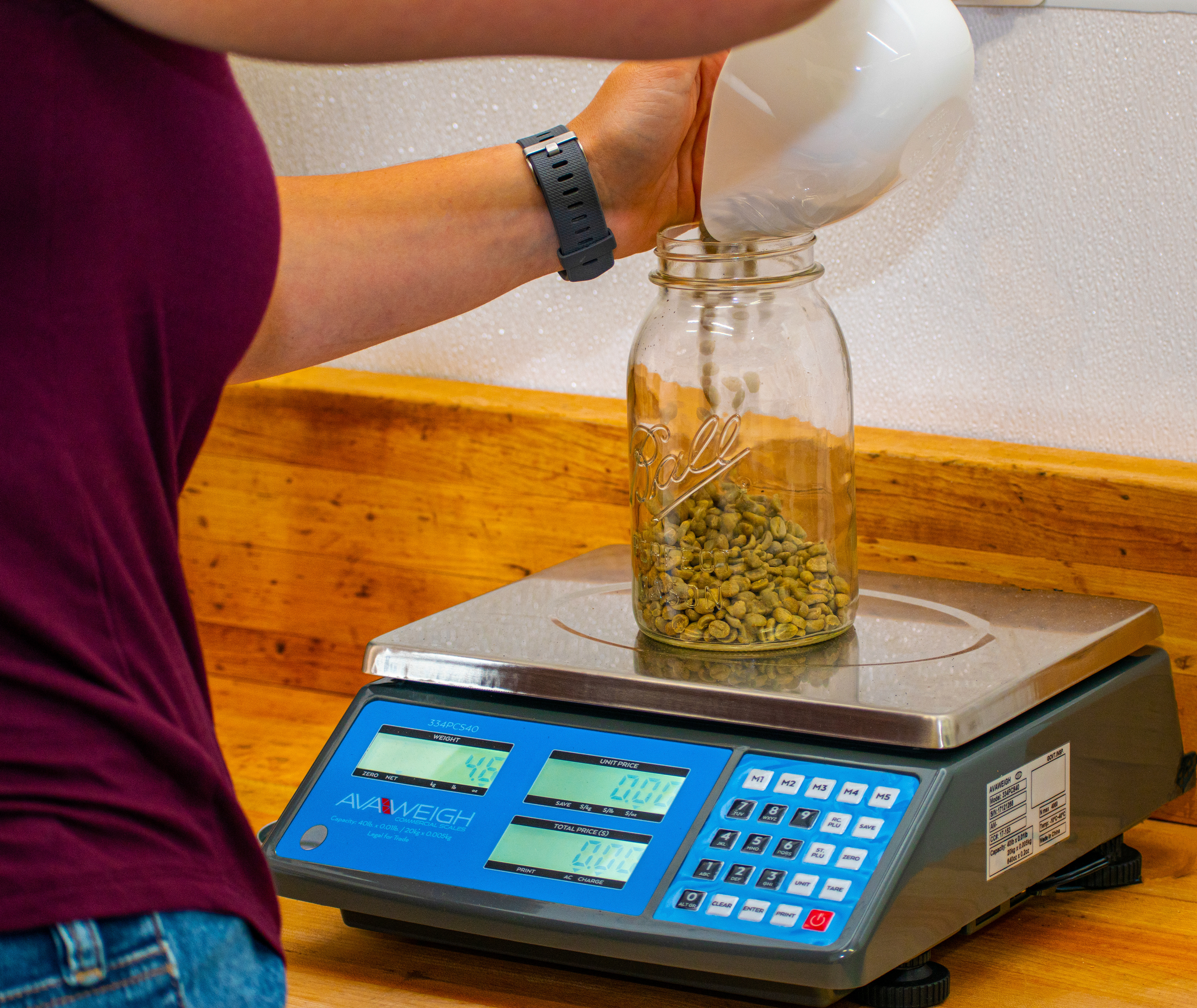 Emily measuring small batch roast