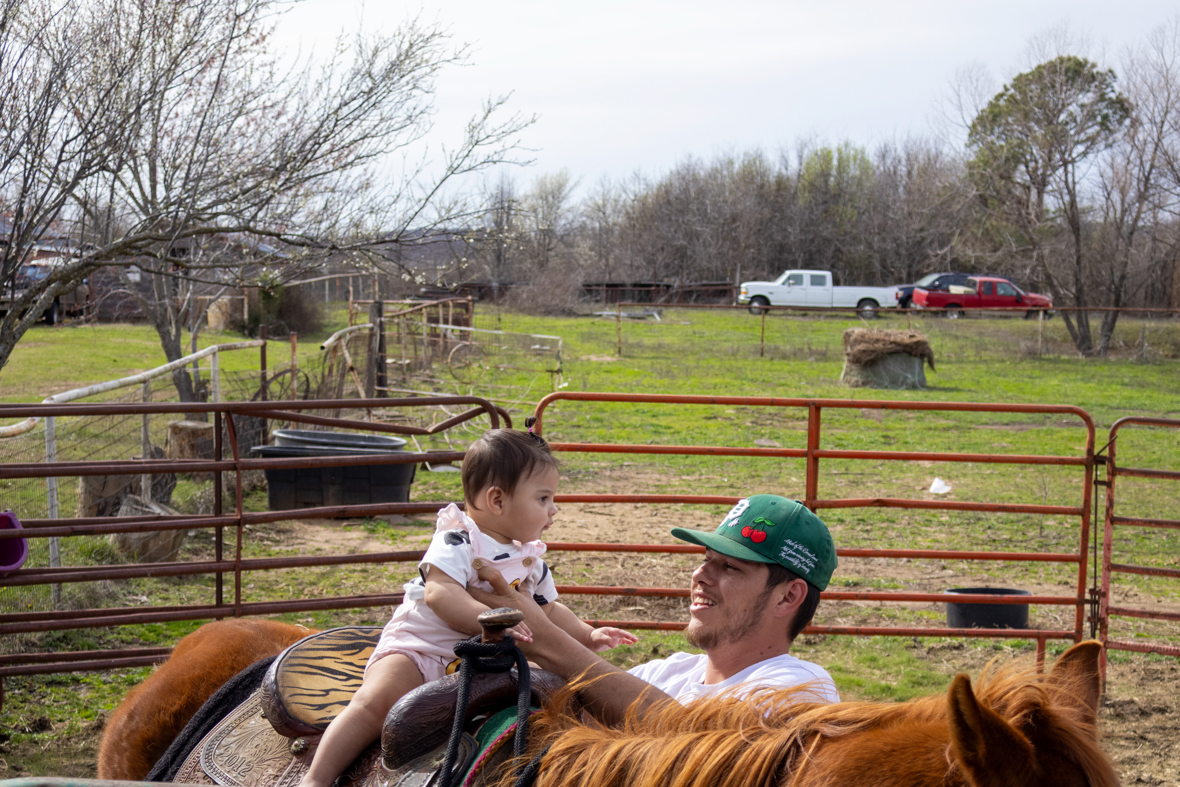- Kane Roberts, 25, steadies his daughter, Lacey, infant, on a family horse. Lauren Sicking