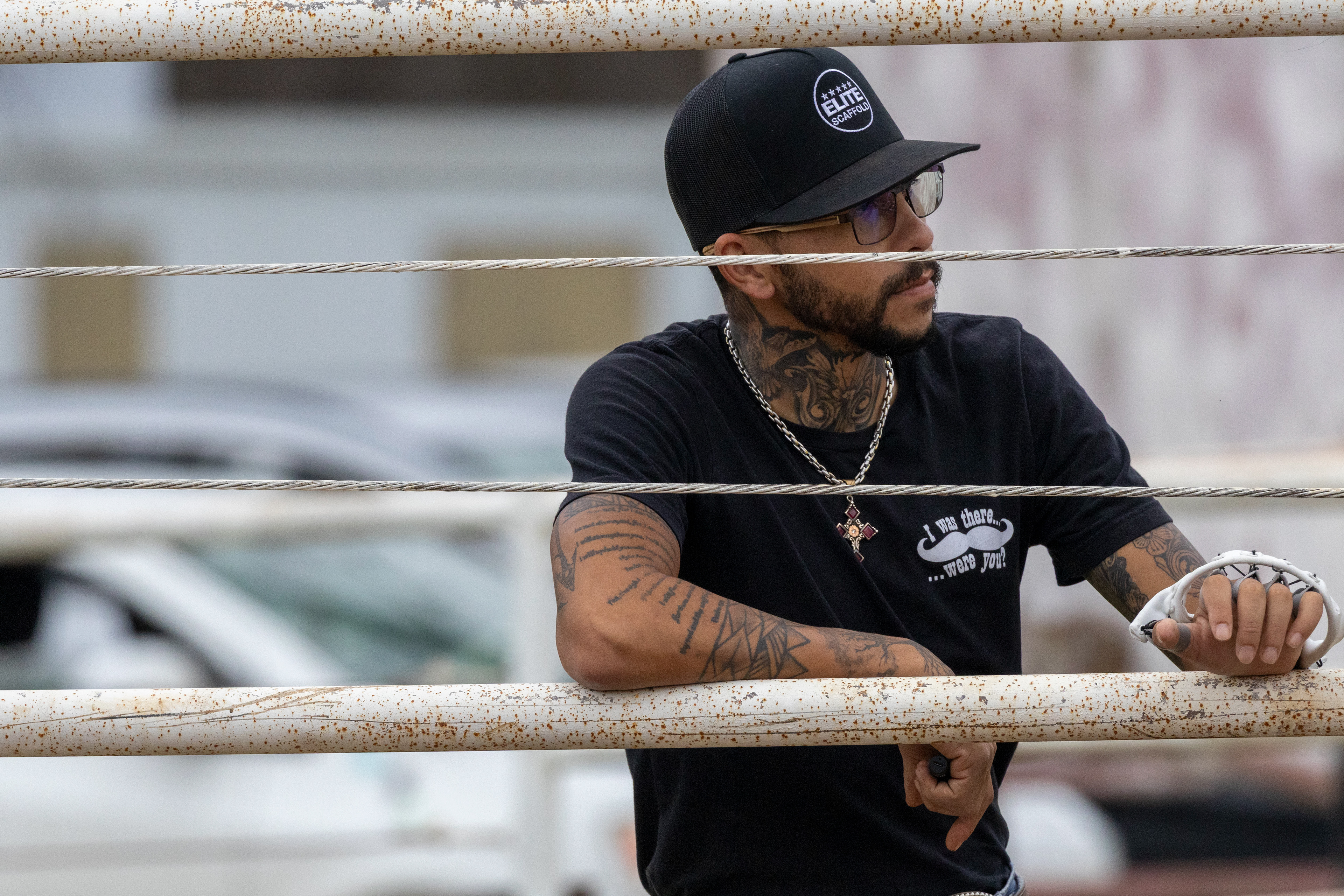 Ryan Roberts, 29, leans on the railing outside of the 4B Brantley Ranch arena. Lauren Sicking