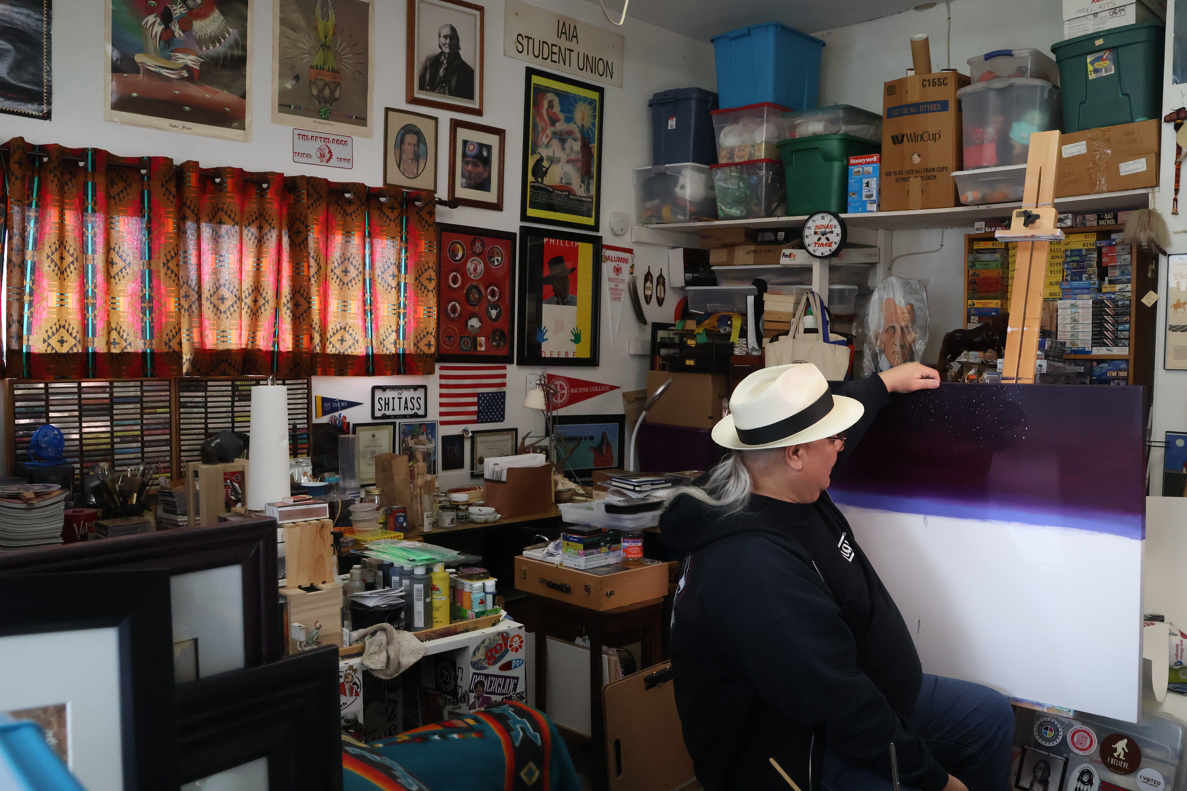 Diacon looking at this unfinished “Trail of Tears” painting for the Alabama Native American History Museum. Elena Andra Stoica