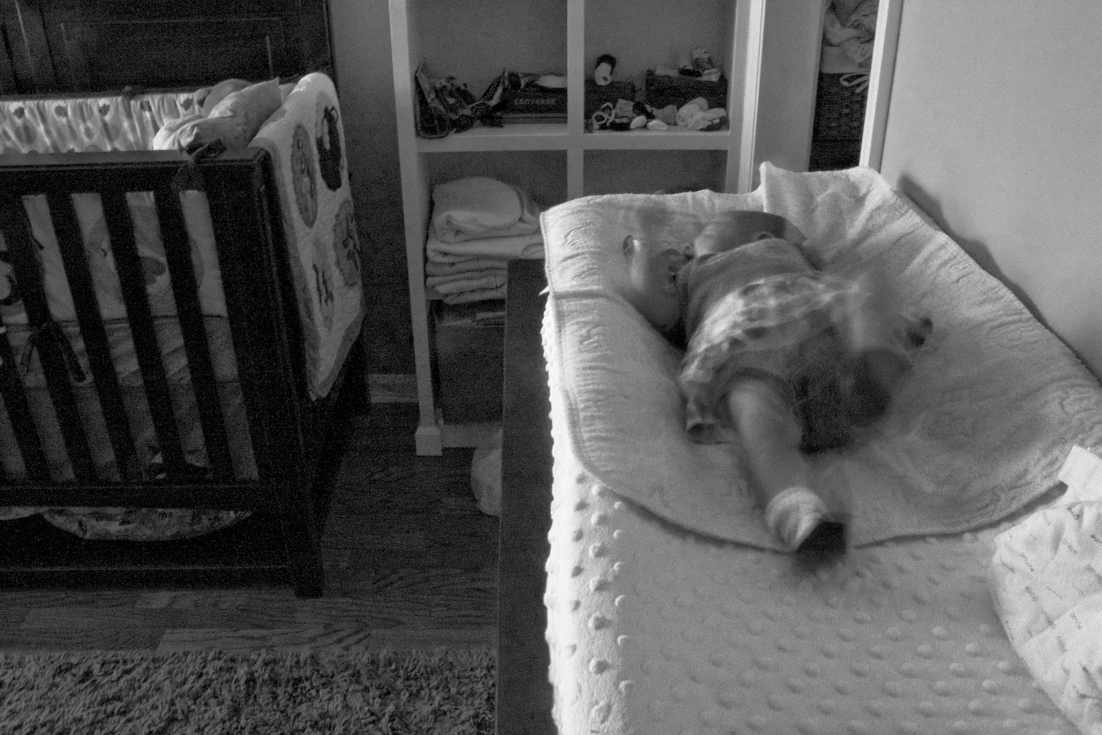 "Alone" The framing of my daughter, and the decision to use black and white help to communicate the feeling that she is alone, unattended & helpless. Clearly, I'm taking the photo, and her mother was just out of frame.