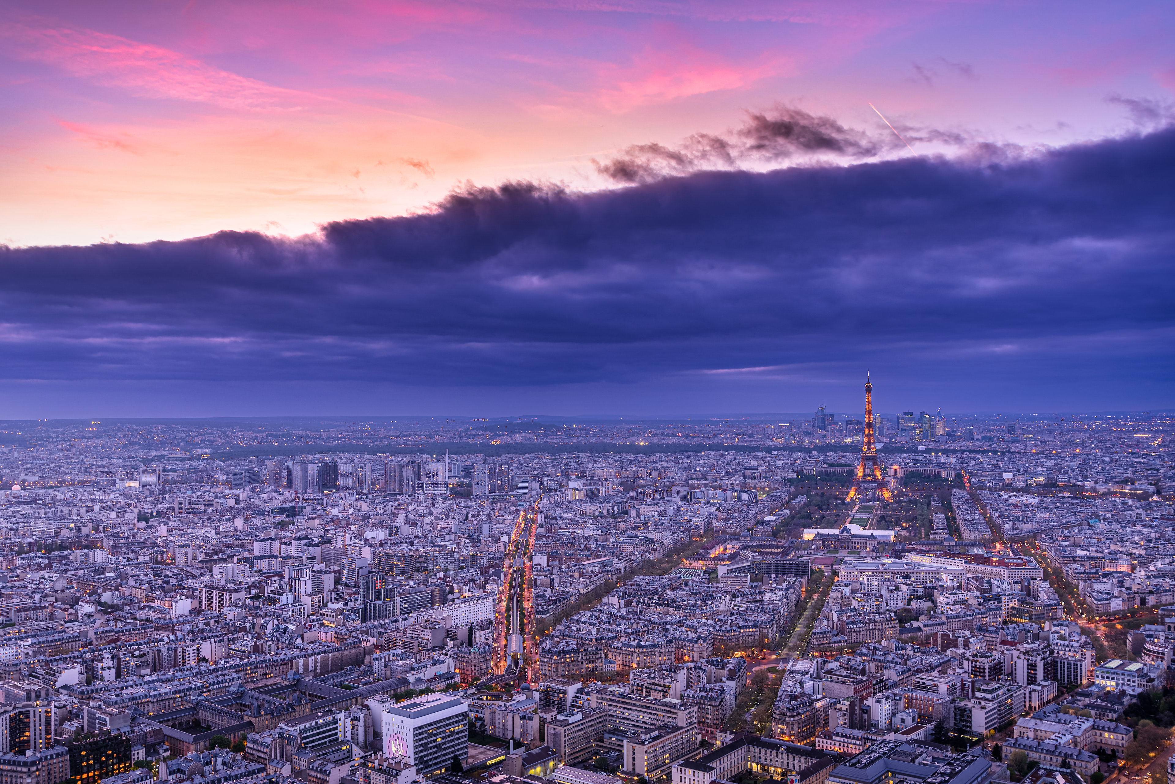 Paris from Tour Montparnasse A vast urban tapestry stretching to the horizon, crowned by the iconic silhouette of the Eiffel Tower.