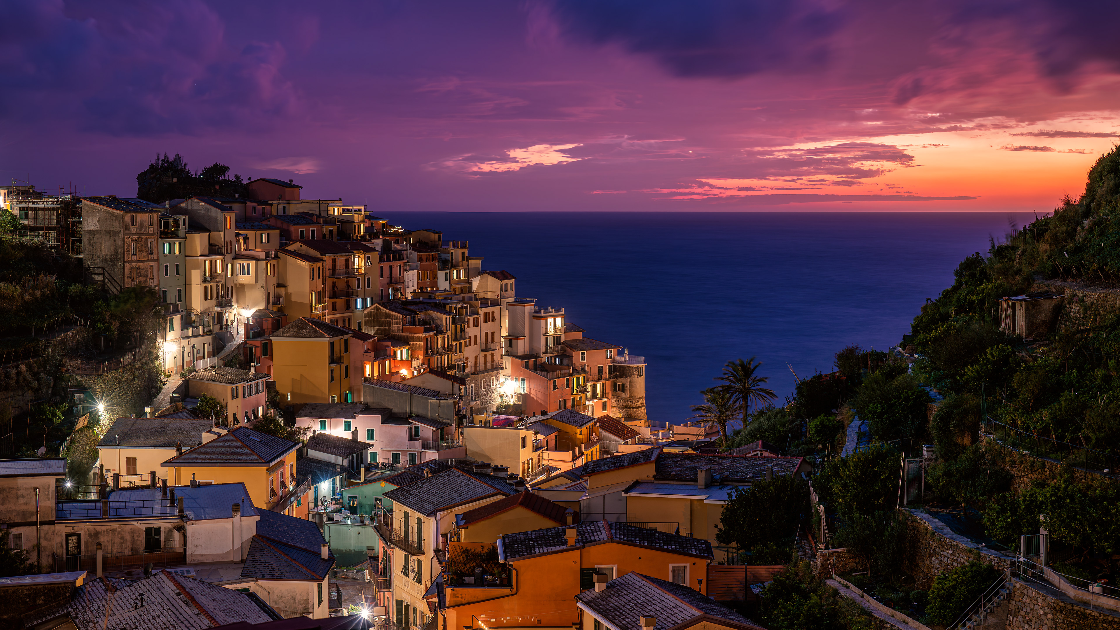 Manarola Evening Glow A cliffside village bathed in the final colors of the Mediterranean sunset.