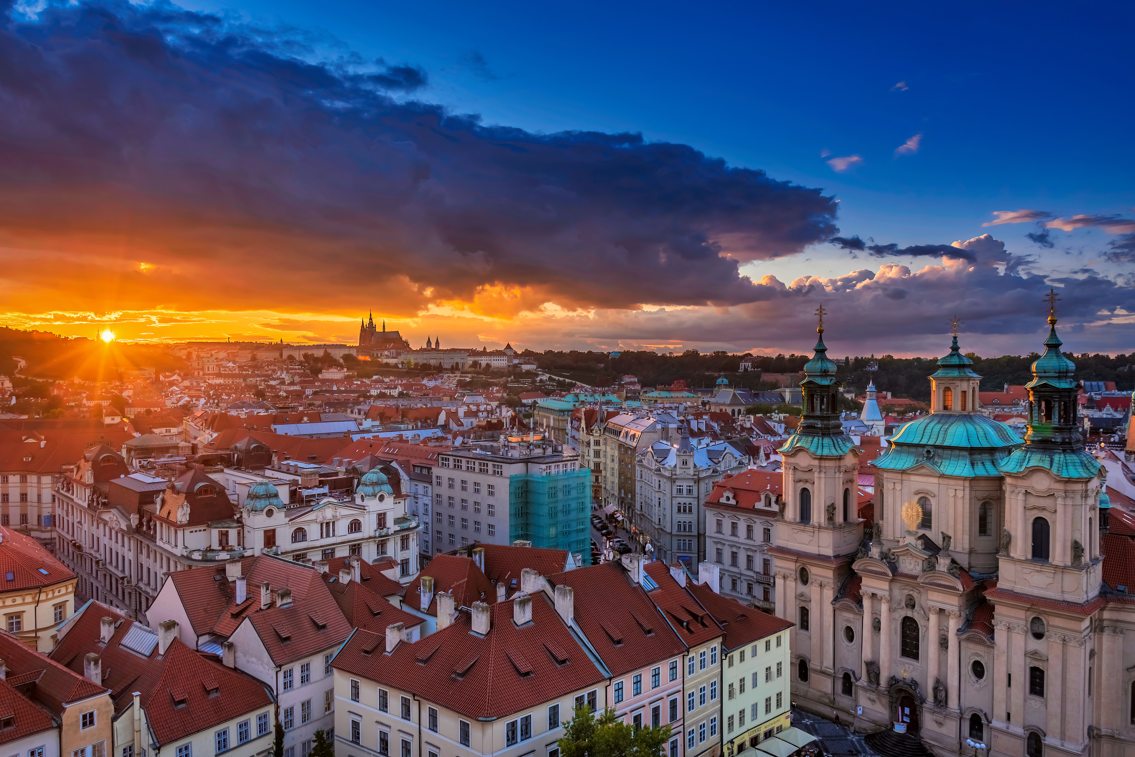 Prague at Sunset Golden light reveals the layered rooftops and spires of the Czech capital.