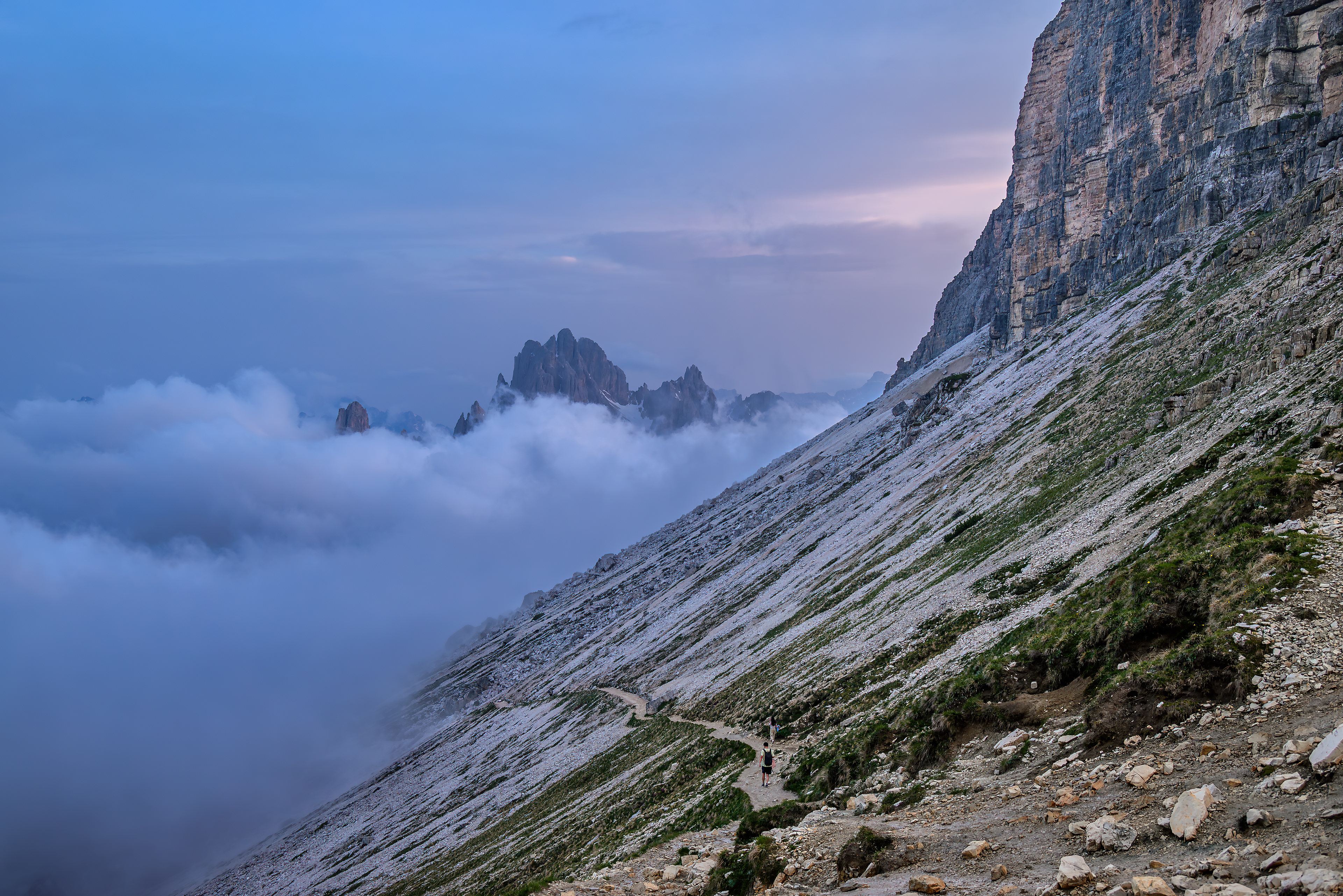 Clouds sitting on the slope of Tre Cime di Lavaredo Peaks