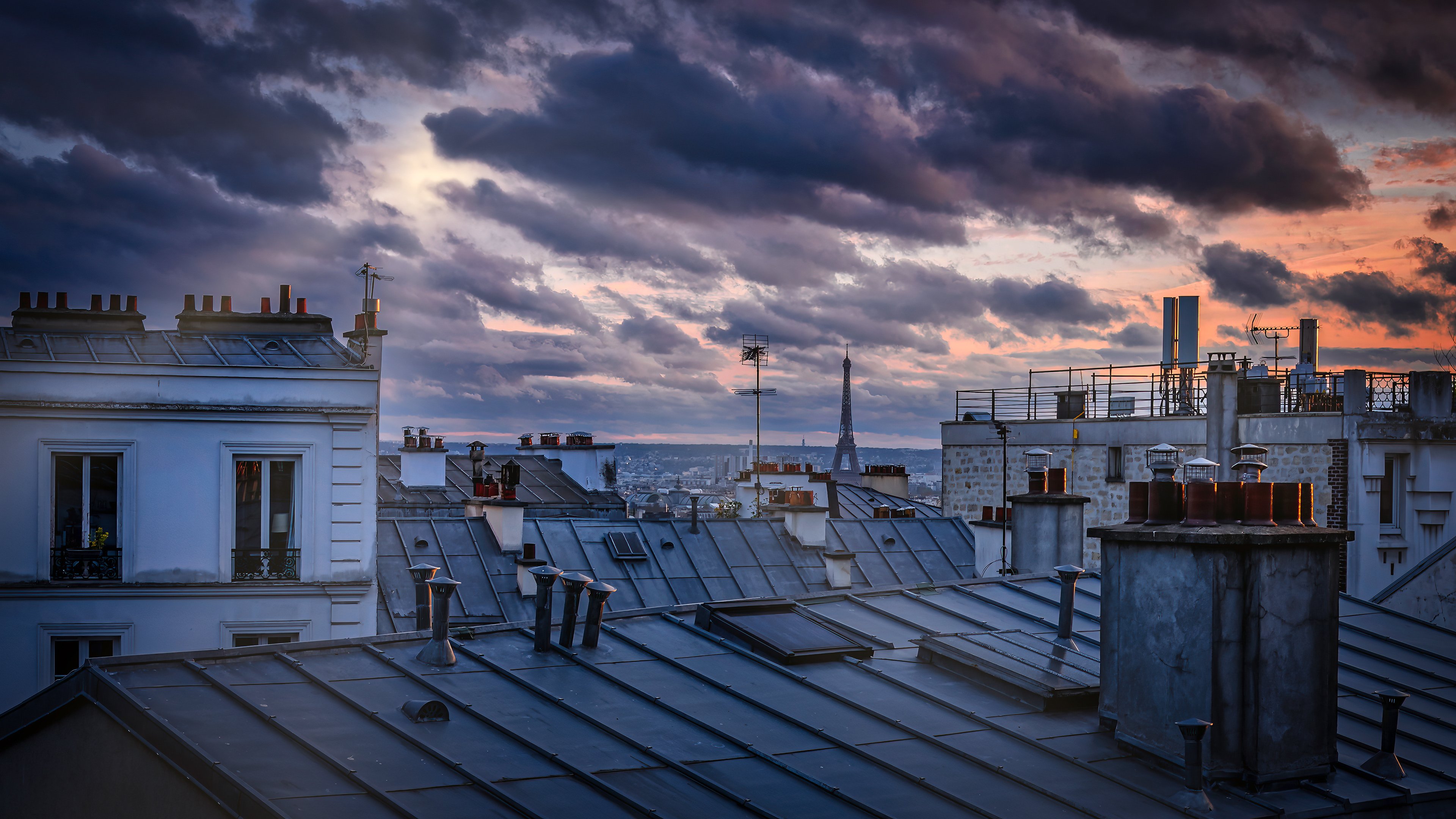 Montmartre Rooftops A quieter side of Paris where chimneys, rooftops and distant monuments define the city's character.