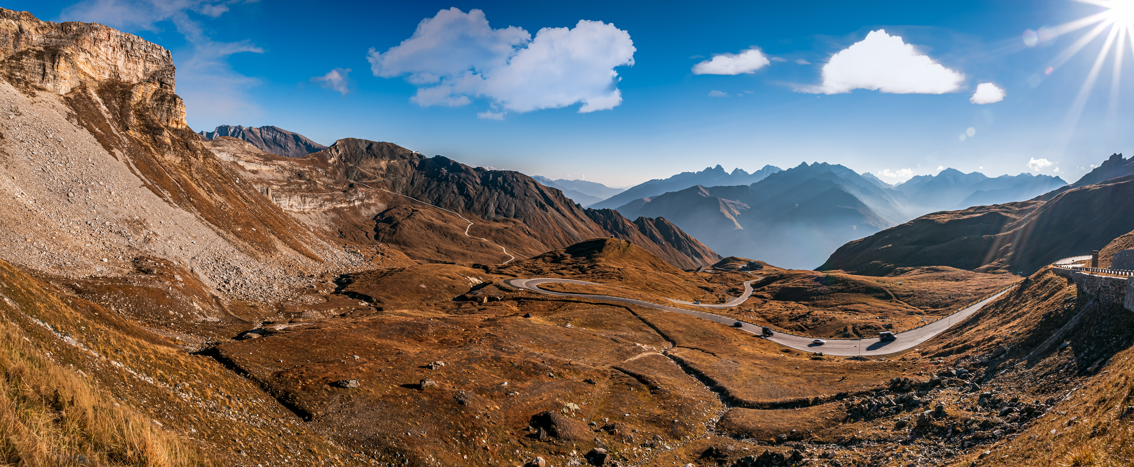 Sunny Alpine road panorama