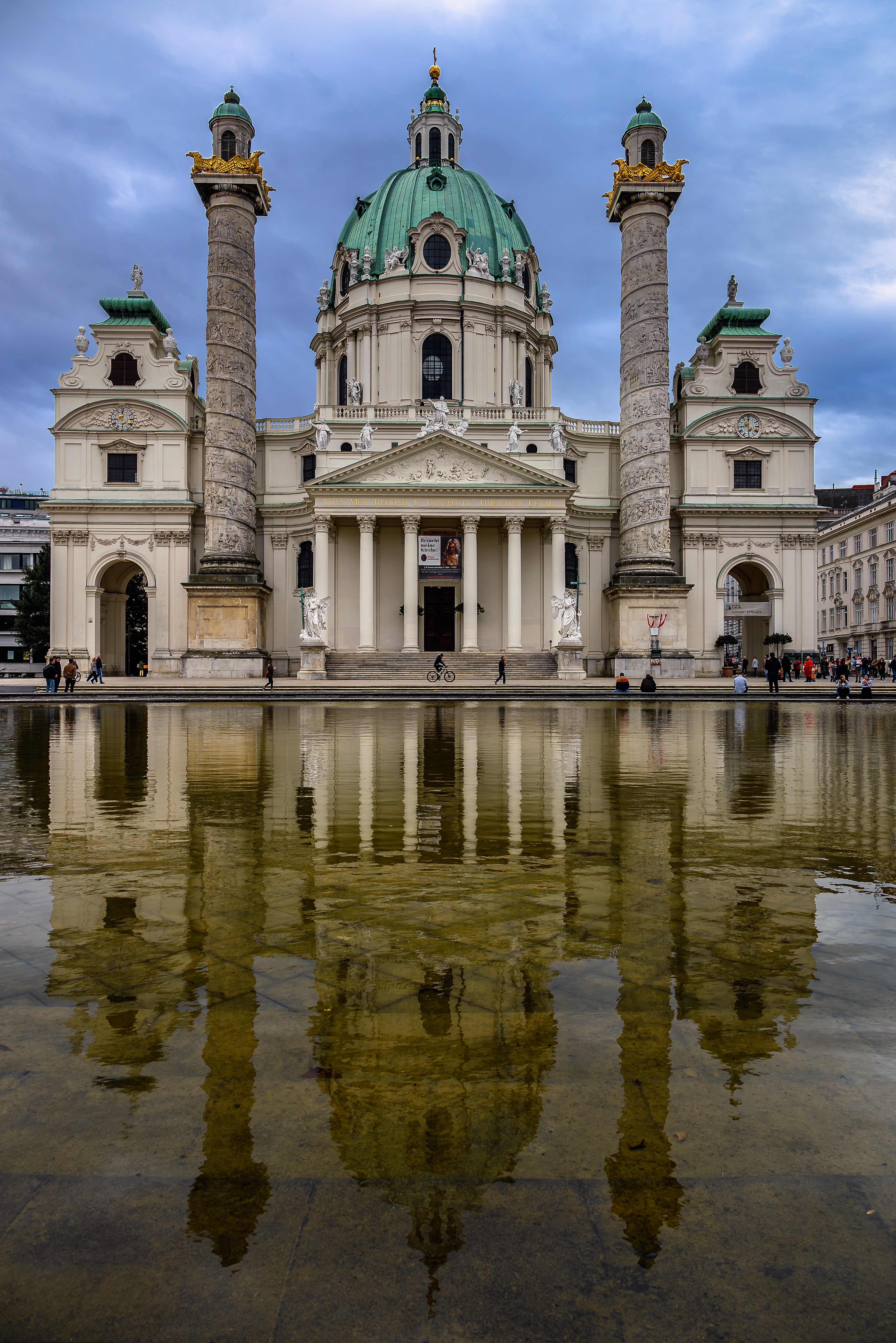 Karlskirche front view with reflection in fountain