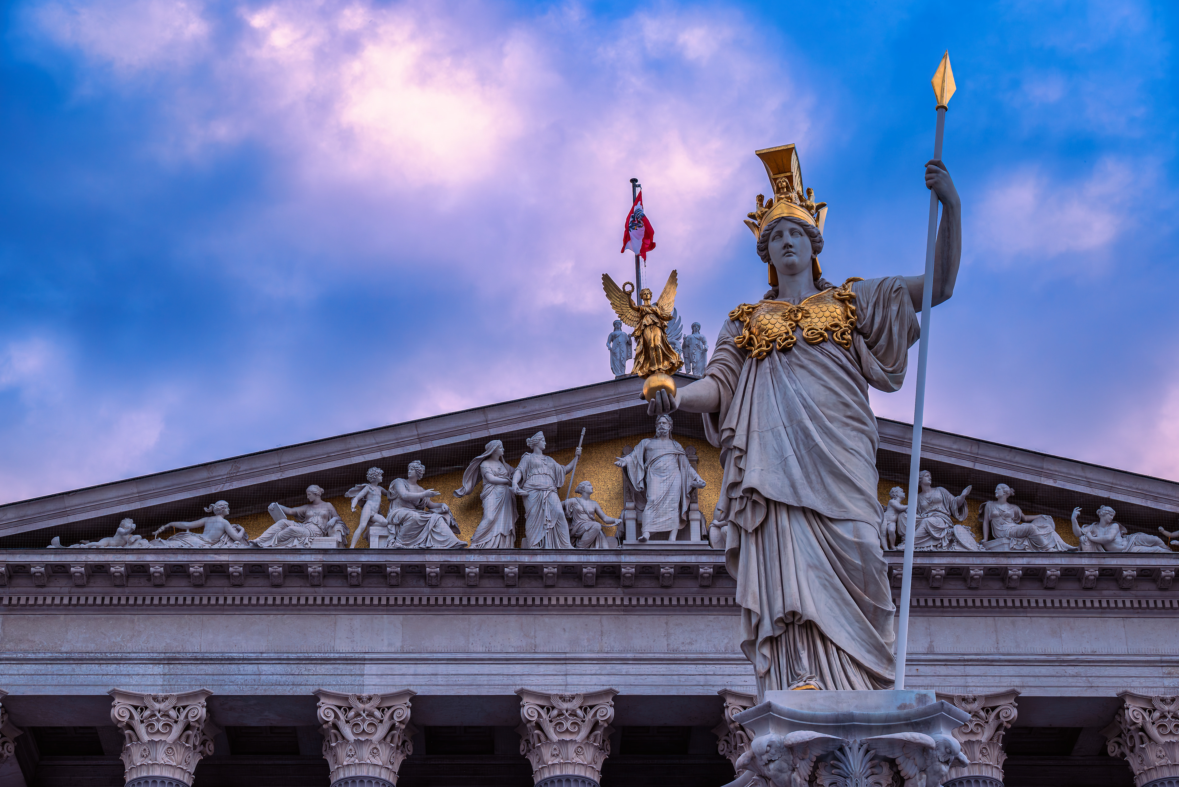 Pallas Athena statue at Vienna Parliament at dusk