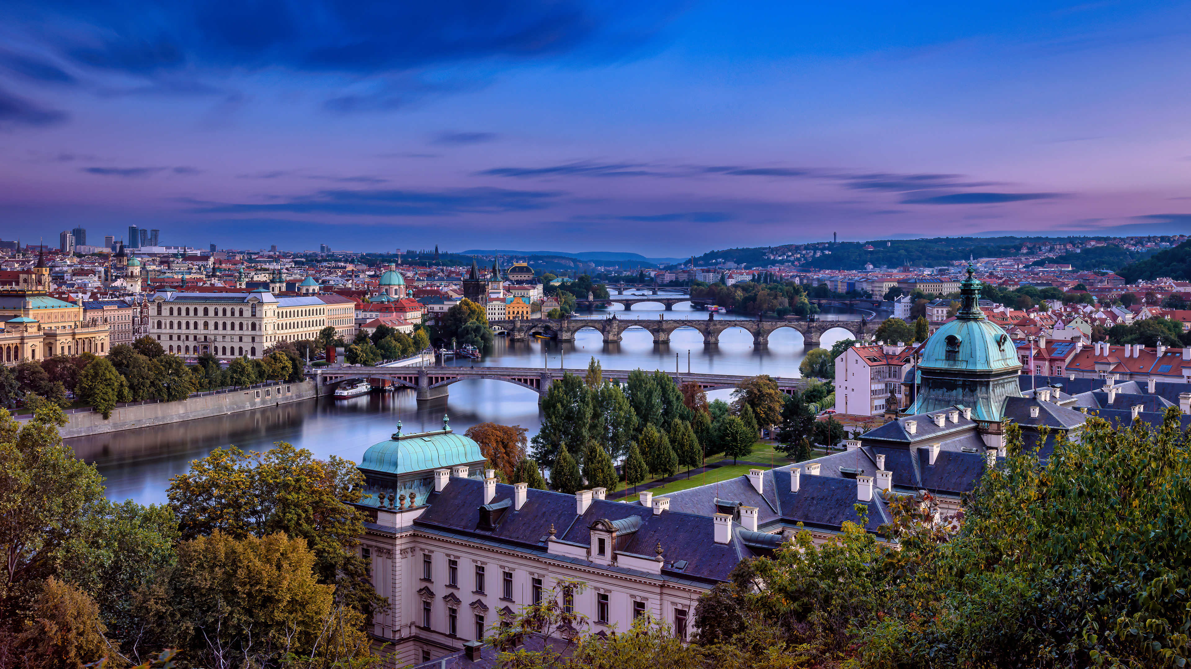 Purple twilight above the bridges of Prague