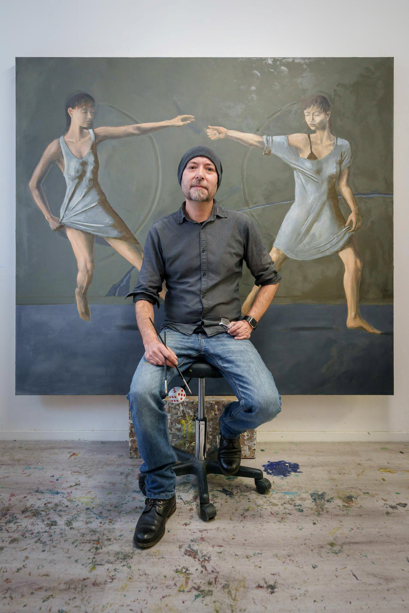 artist Egmont Hartwig in his studio painting a new large scale oil painting
