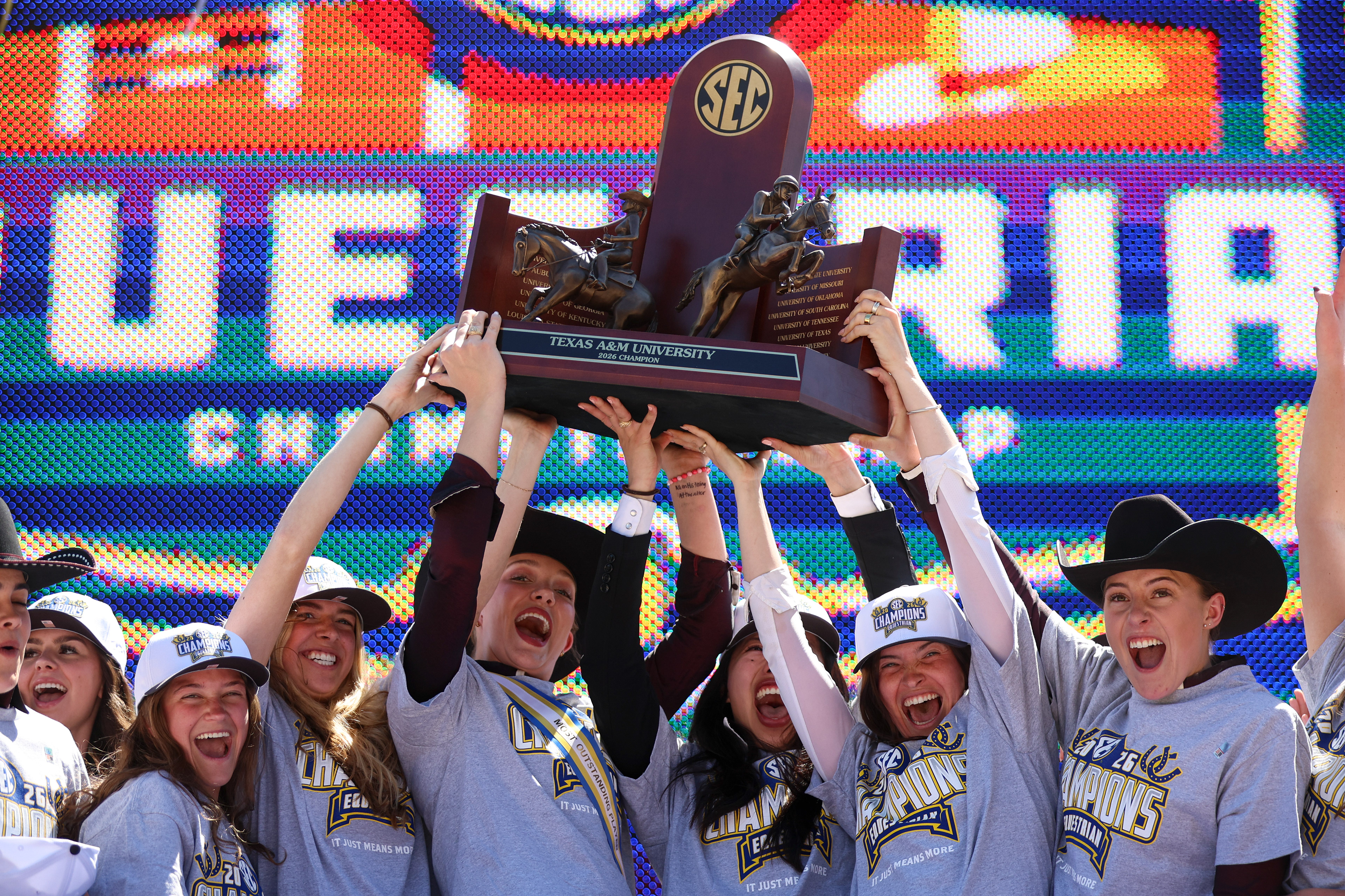 The Texas A&M Equestrian team raises the SEC Championship trophy for the first time in program history at the Auburn University Equestrian Center in Auburn, Alabama on March 28, 2026.