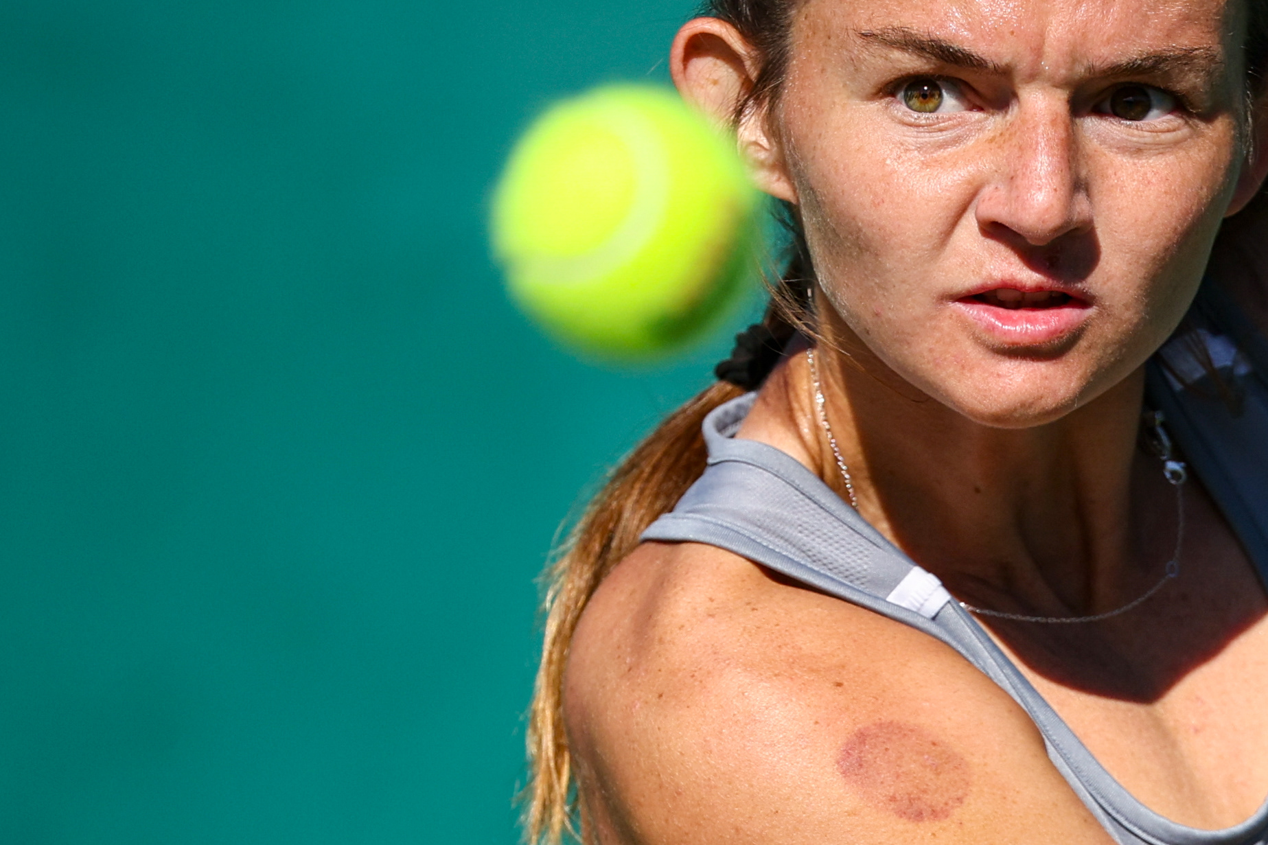 Nichole Khirin of the Texas A&M Aggies eyes a ball during her match against Stanford's Connie Ma at the Hurd Tennis Center in Waco, Texas on November 21, 2024. 