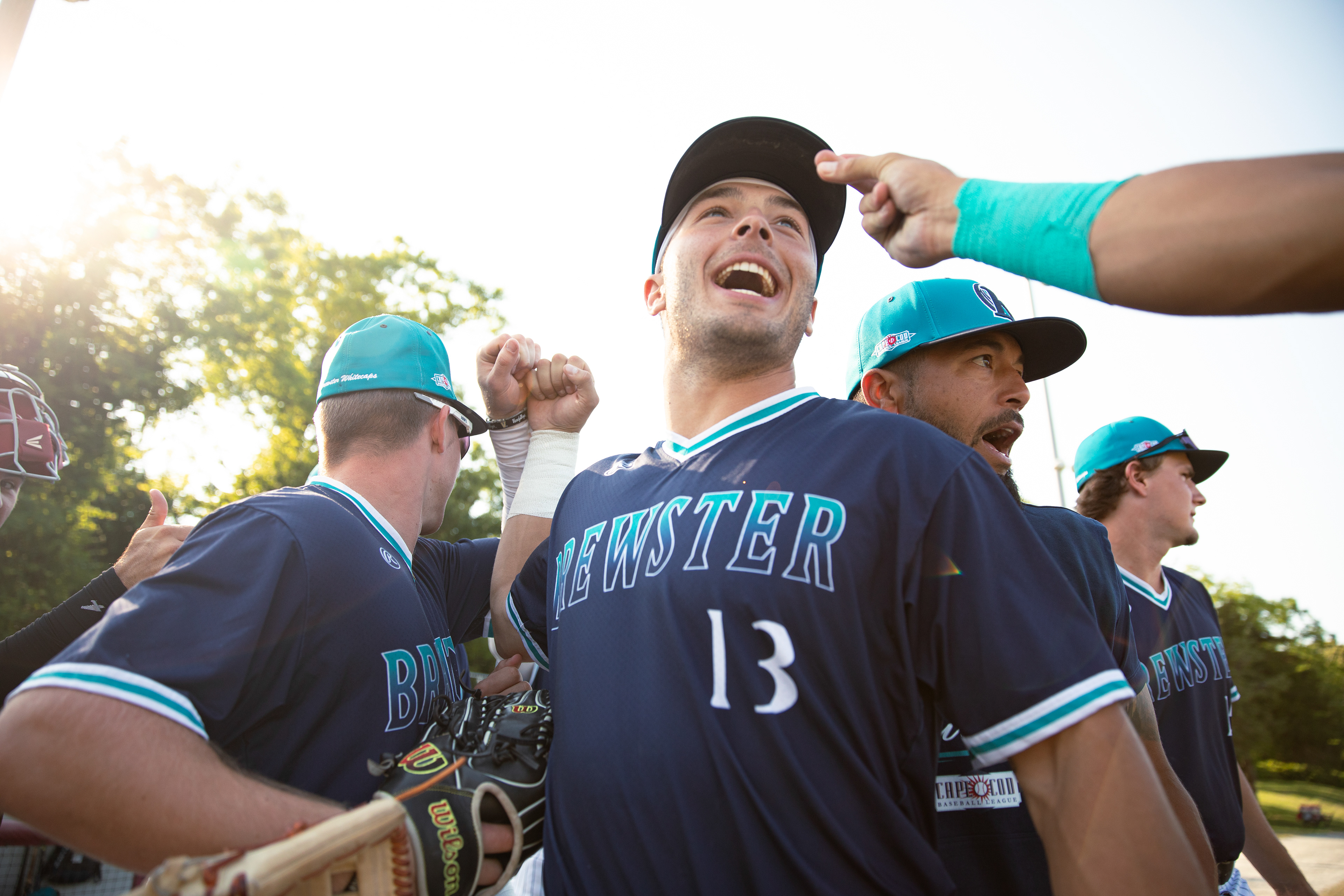 Brewster Whitecaps 3B Andrew Fischer (13) breaks out of a huddle before their game against the Falmouth Commodores at Guv Fuller Field in Falmouth, Massachusetts, on June 18, 2024.