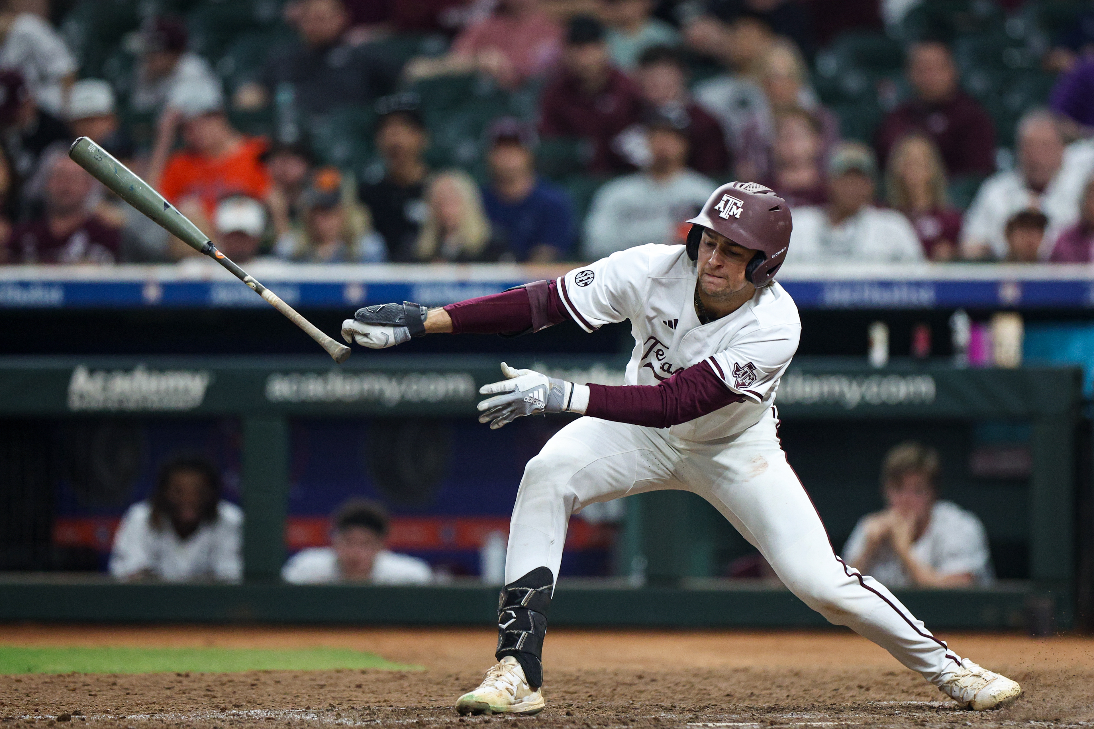 Texas A&M SS Kaeden Kent (6) loses grip on his bat during the game against the Oklahoma State Cowboys at Daikin Park in Houston, Texas on March 1, 2025.