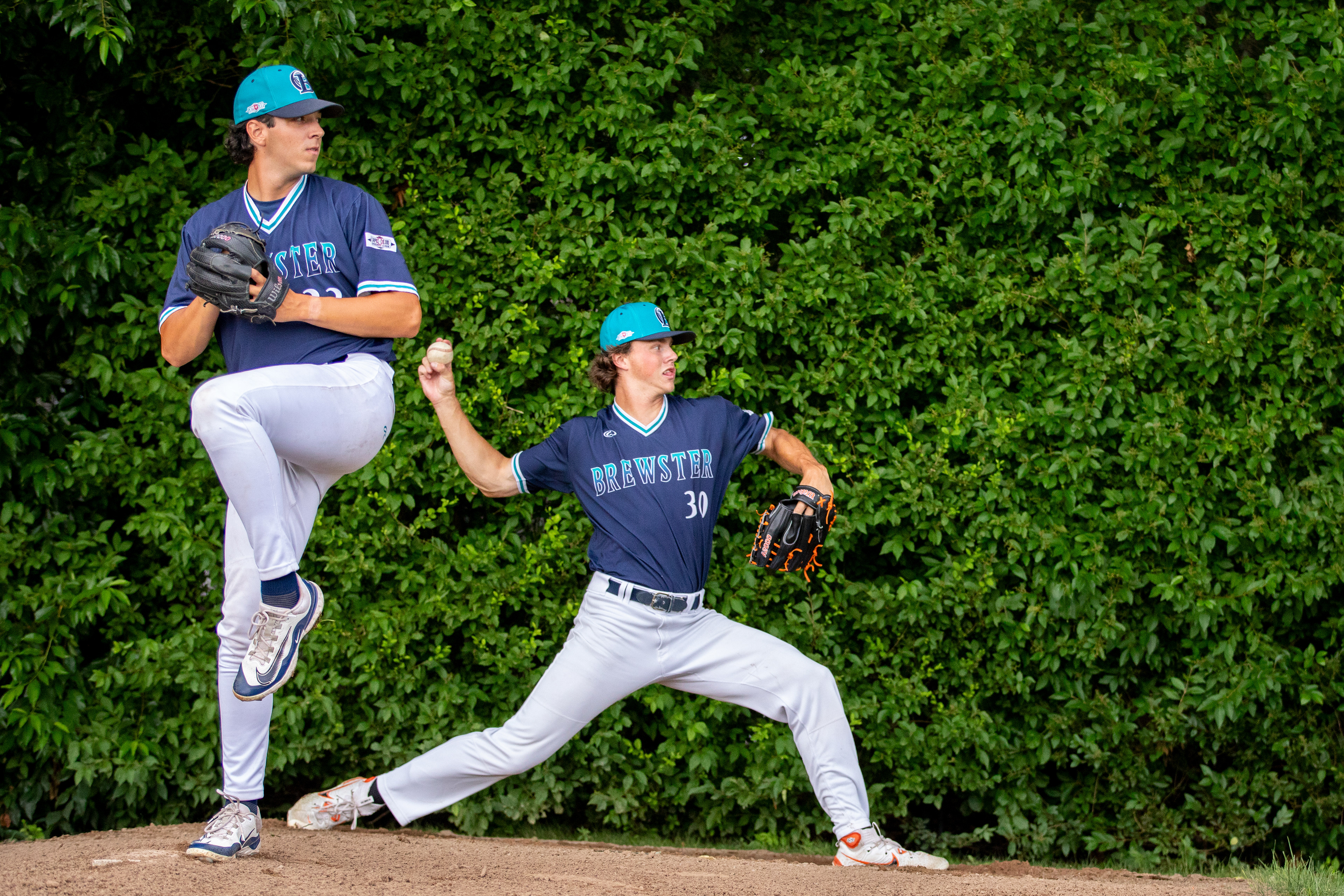 Brewster Whitecaps Pitchers Evan O'toole (30) and Luke Guth (33) throw warm-up pitches during the game against the Y-D Red Sox at Red-Wilson Field in Yartmouth-Dennis, Massachusetts on July 23, 2024.