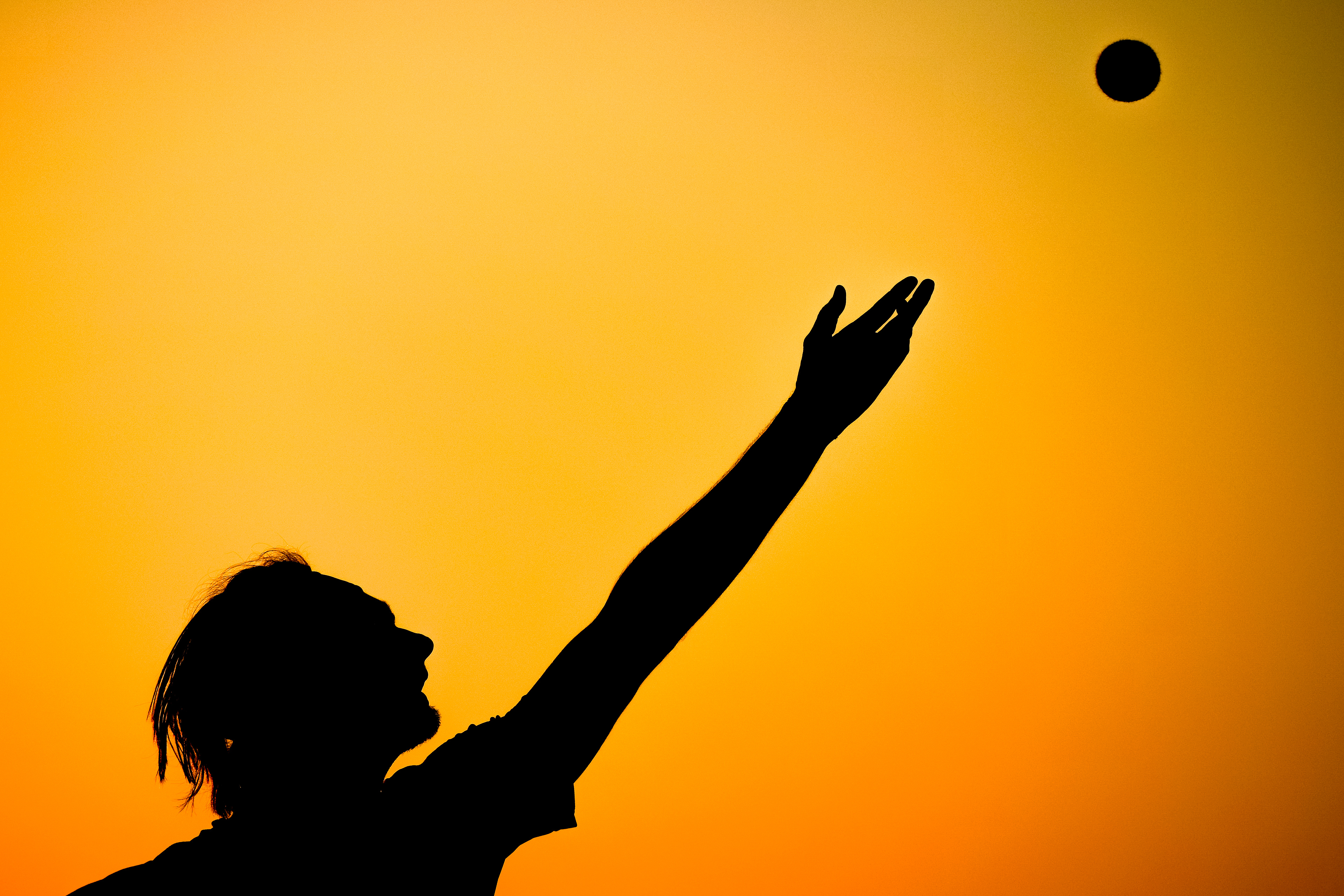 Damien Salvestre of the Texas A&M Aggies serves the ball during the game against the Lamar Cardinals at the Mitchell Tennis Center in College Station, Texas on February 23, 2025. 