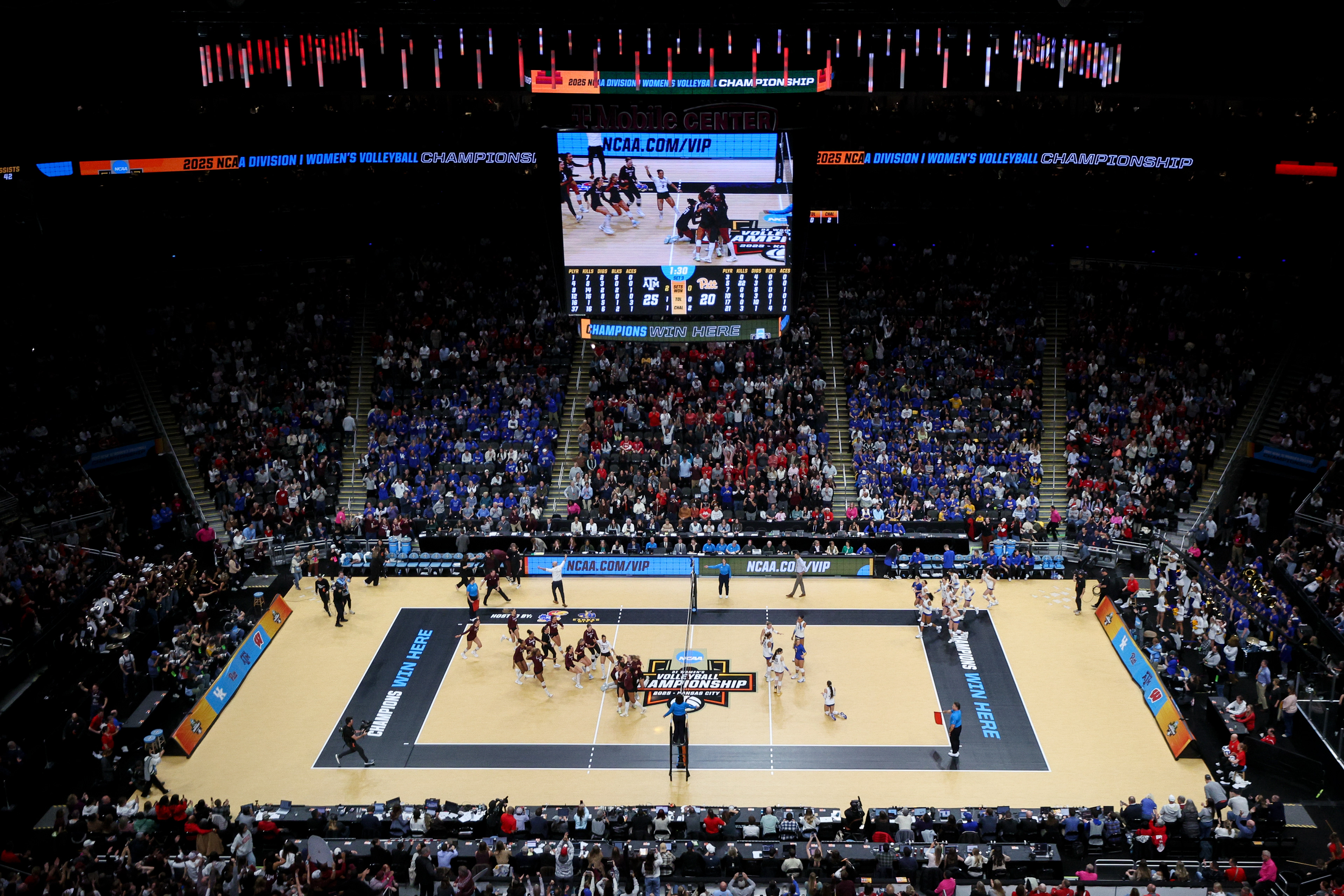 The Texas A&M Volleyball team rushes the court after defeating Pittsburg in the NCAA Final four to make it to the national championship at the T-Mobile Center in Kansas City, Missouri on December 18, 2025.