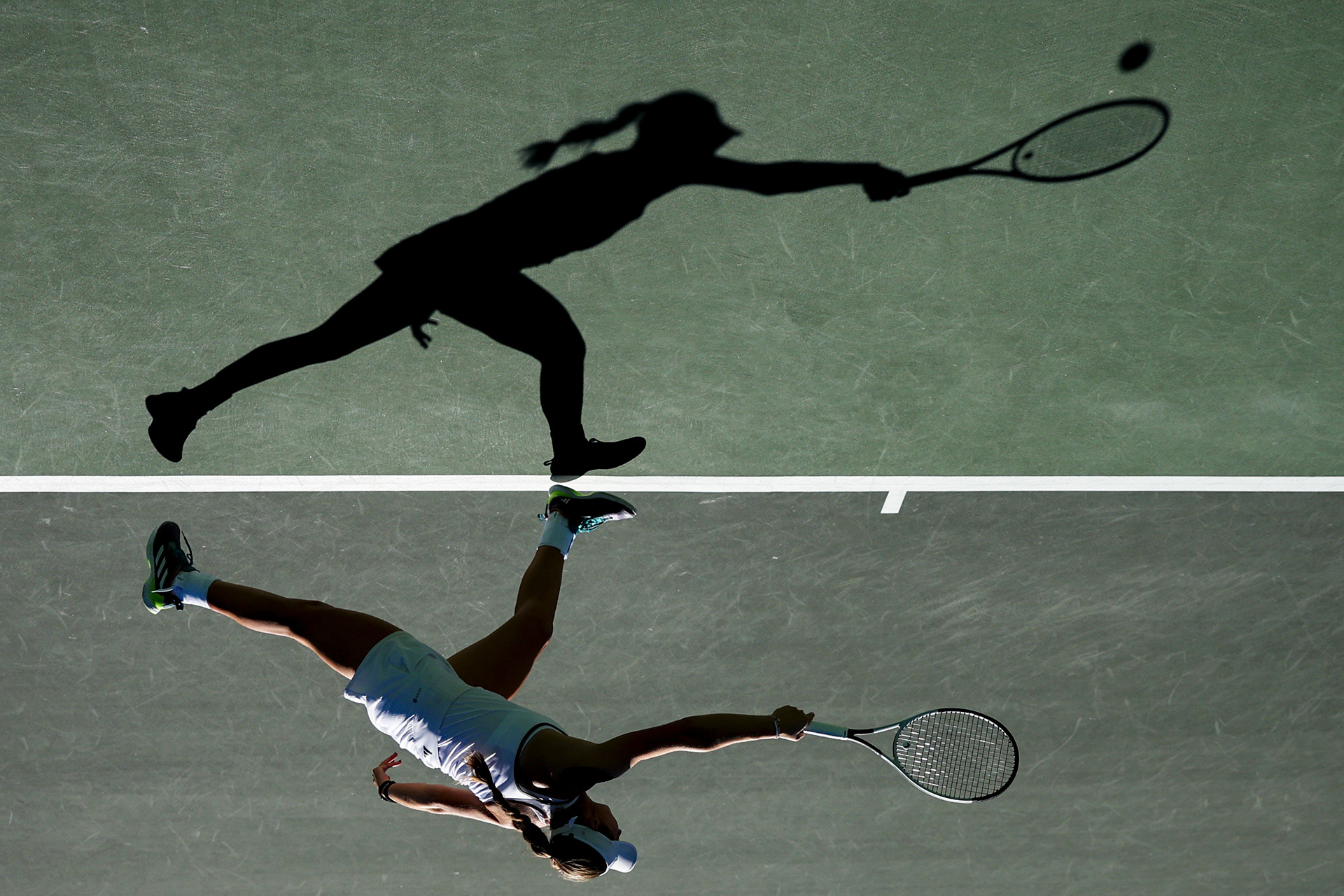 Mary Stoiana of the Texas A&M Aggies reaches for a ball during her match against Virginia's Elaine Chervinsky at the Hurd Tennis Center in Waco, Texas on November 21, 2024.  