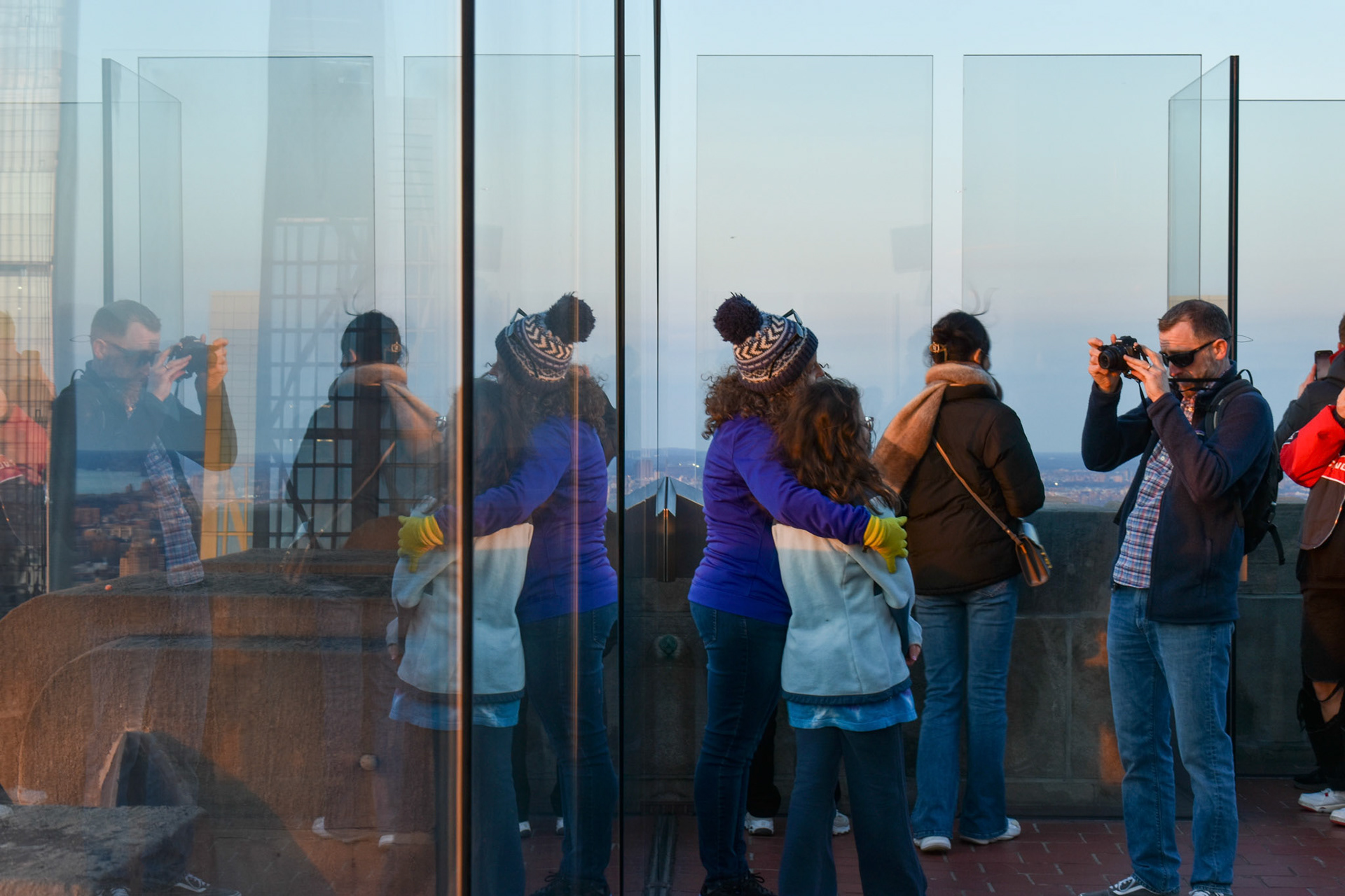 Family Photo: A man photographs his family.