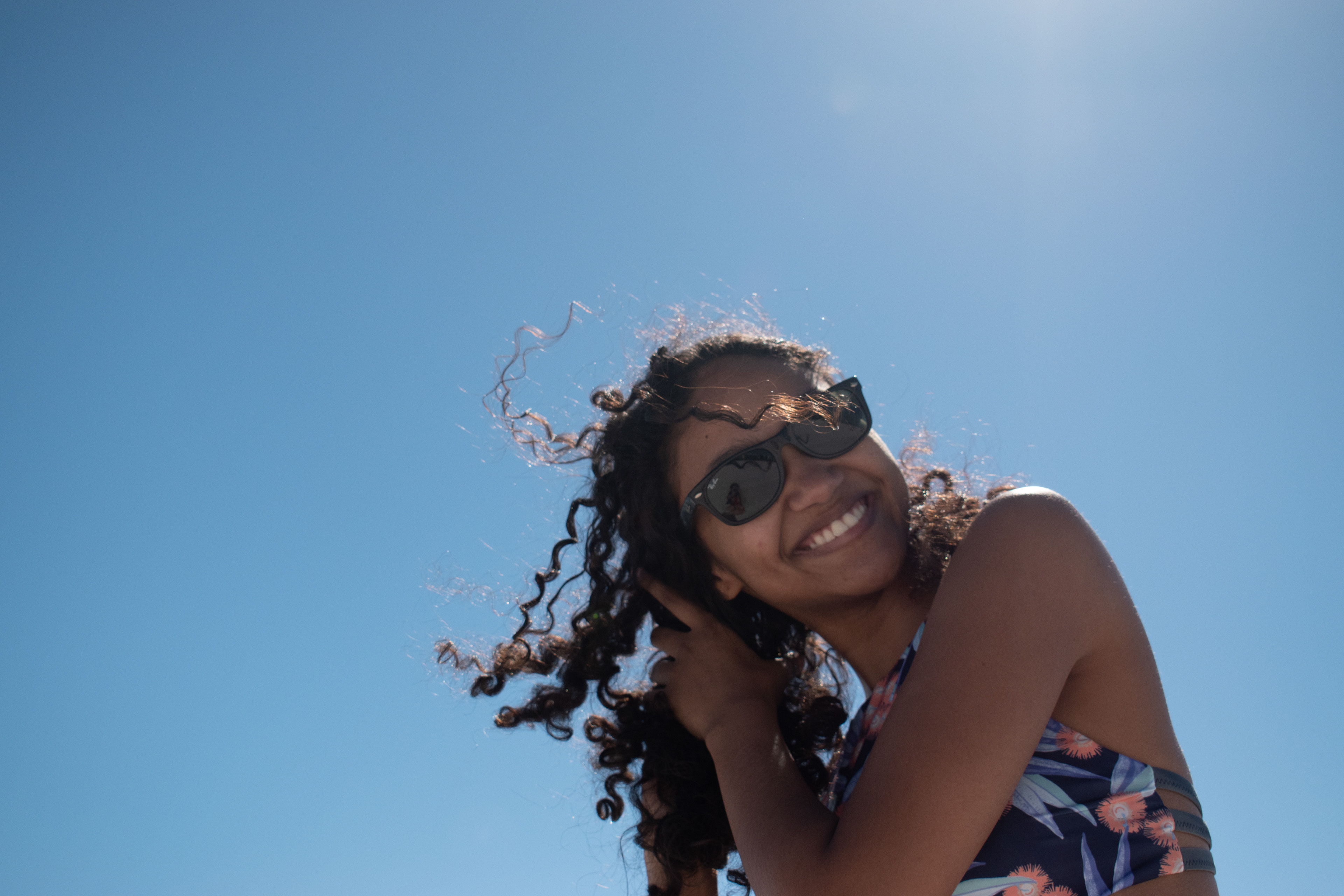 Arielle: Arielle Marrero smiling at the beach.