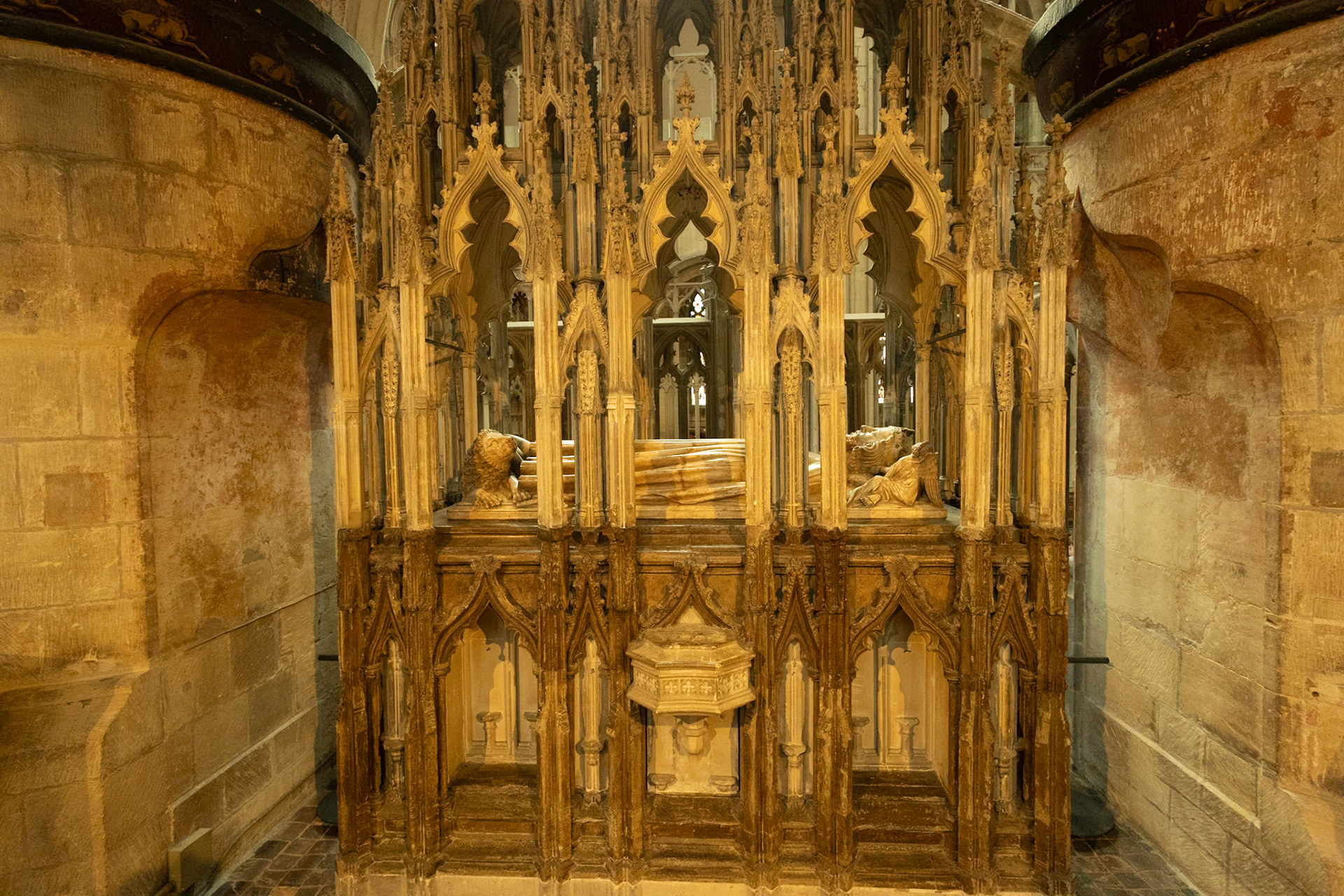 Tomb of Edward II. Description suggests he wasn't very competent. He was forced to abdicate by his own wife and her French toy boy. Edward was murdered in 1327. Legend says that the deed was done with a red hot poker