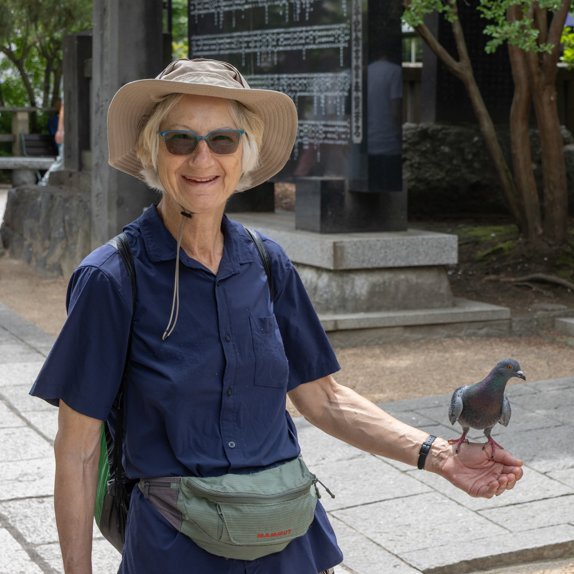 Cathy with pigeon, Ebisu-jinja Shrine