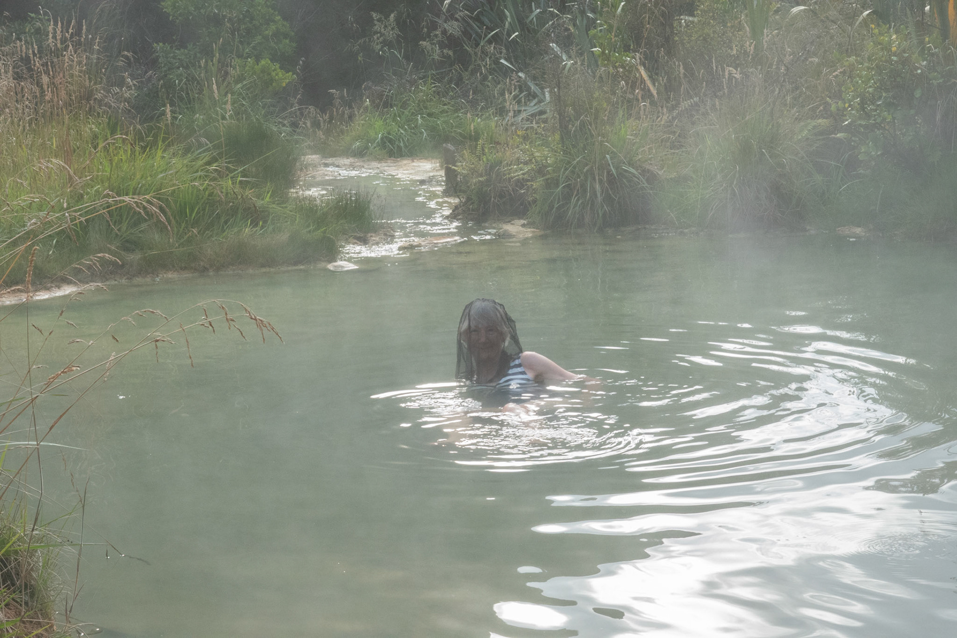 Cathy on got pool - fly net to keep sandflies away